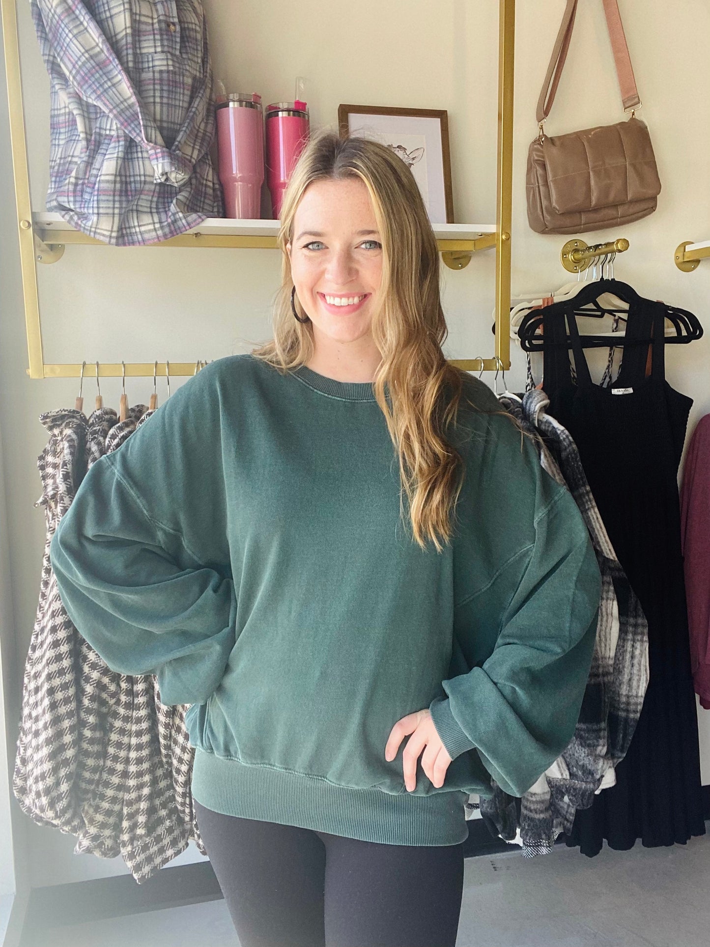 This Deep Emerald Lazy Days Sweatshirt is a great casual style for the fall. With its slouchy fit and drop shoulder silhouette, it's the perfect piece to pair with leggings, joggers, or jeans. Crafted from a vintage washed style fabric, it's sure to become a wardrobe favorite.