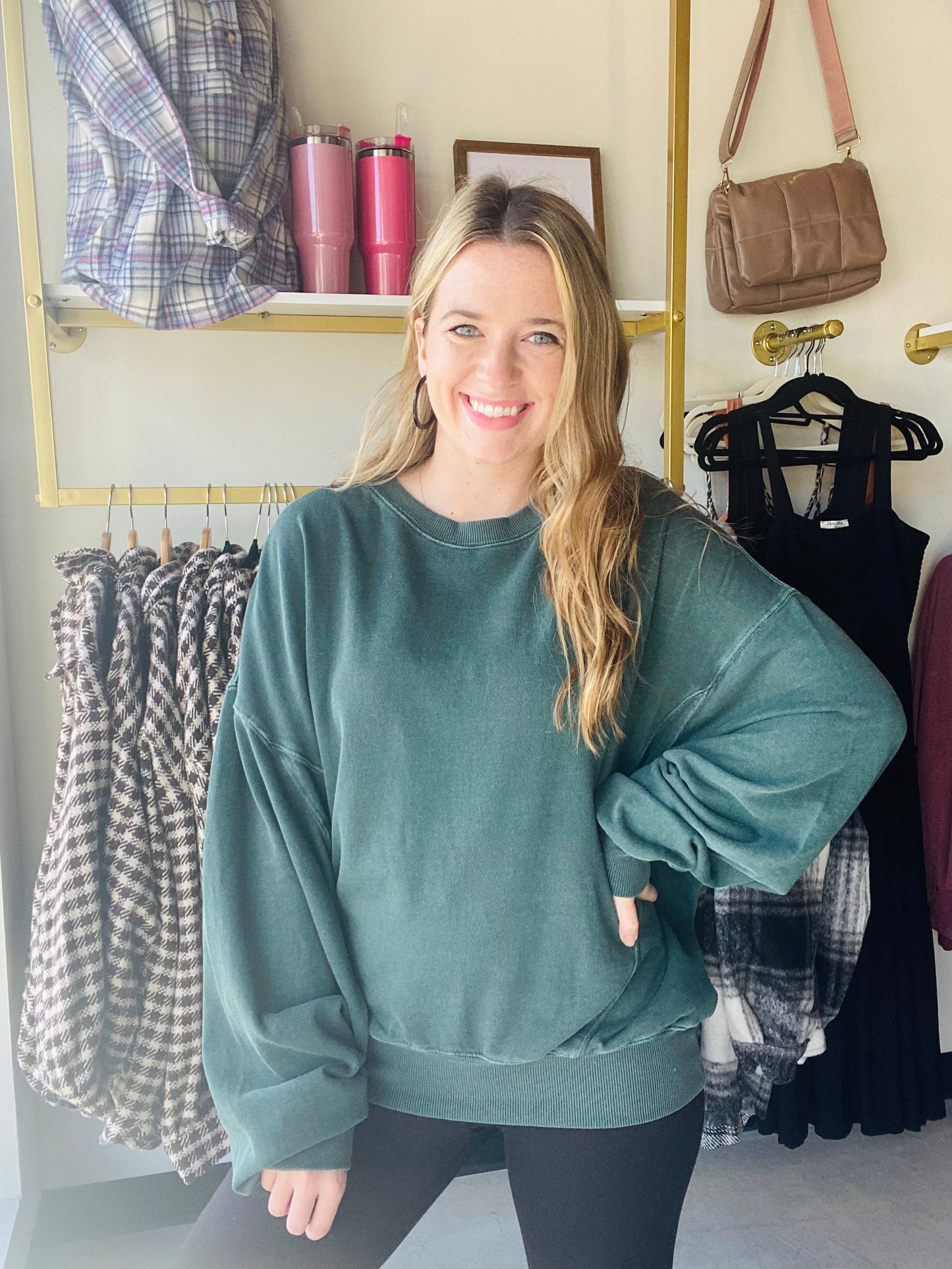This Deep Emerald Lazy Days Sweatshirt is a great casual style for the fall. With its slouchy fit and drop shoulder silhouette, it's the perfect piece to pair with leggings, joggers, or jeans. Crafted from a vintage washed style fabric, it's sure to become a wardrobe favorite.
