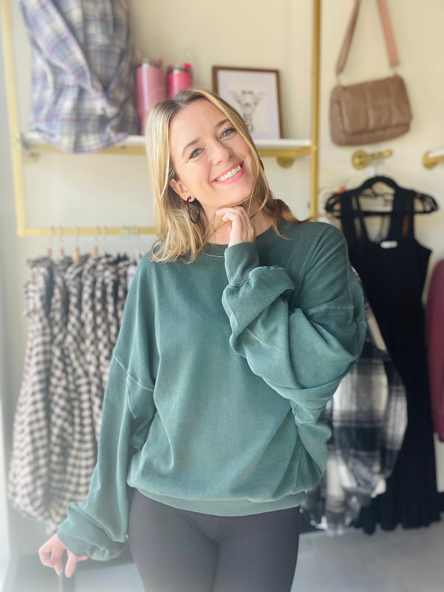 This Deep Emerald Lazy Days Sweatshirt is a great casual style for the fall. With its slouchy fit and drop shoulder silhouette, it's the perfect piece to pair with leggings, joggers, or jeans. Crafted from a vintage washed style fabric, it's sure to become a wardrobe favorite.