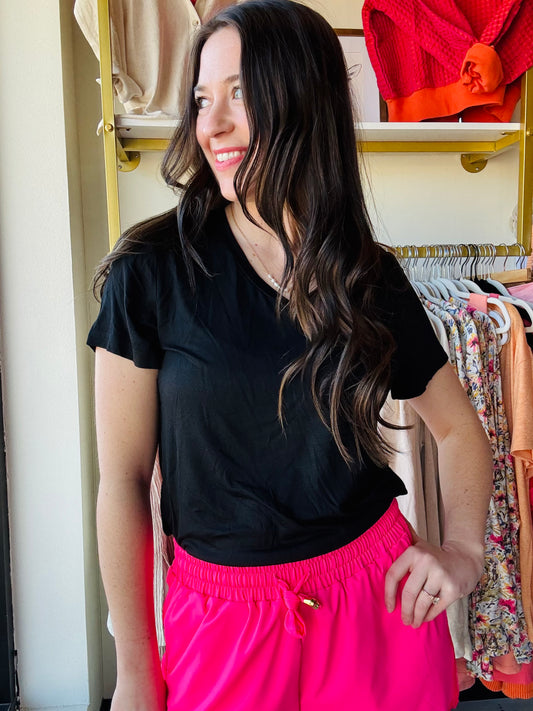 We know we're always on the lookout for a good, comfy basic! This basic tee is definitely one of those pieces! It's comfy and a perfect fit that makes it so easy to wear and the colors make styling and layering it a breeze! These top features short sleeves, a V-neck, and a rounded hemline. 