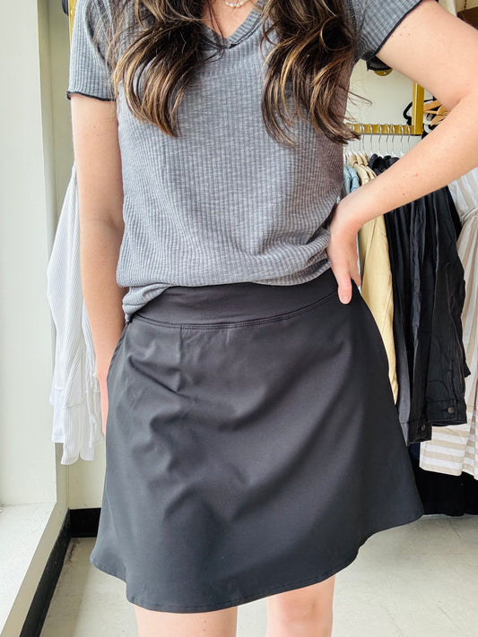 Made for moving through your day and looking cute without even trying, this classic skort features a double-layered skirt over stretchy shorts with an elastic waistband and dual side pockets.