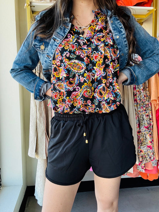 Jess Lea
These mid-rise solid black shorts are so perfect for the spring and summer and even to wear into the fall! Get the effortless yet chic look with these shorts. They feature a mid-rise, tie waist drawstring, & side pockets. These are a relaxed fit.