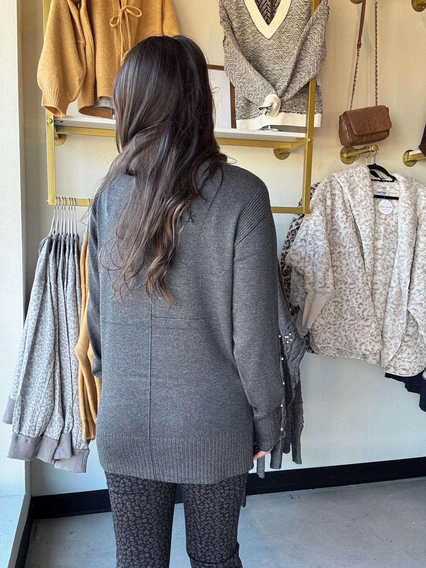 Tribal 
Cozy up in this Drop Shoulder Charcoal Turtleneck, designed with ultra-soft rayon nylon yarn to keep you warm and comfy all day. Its long sleeves offer full coverage, perfect for chilly days, while the sleek front accent seam adds a fun modern twist to your look. Easy to wear and impossible to resist!