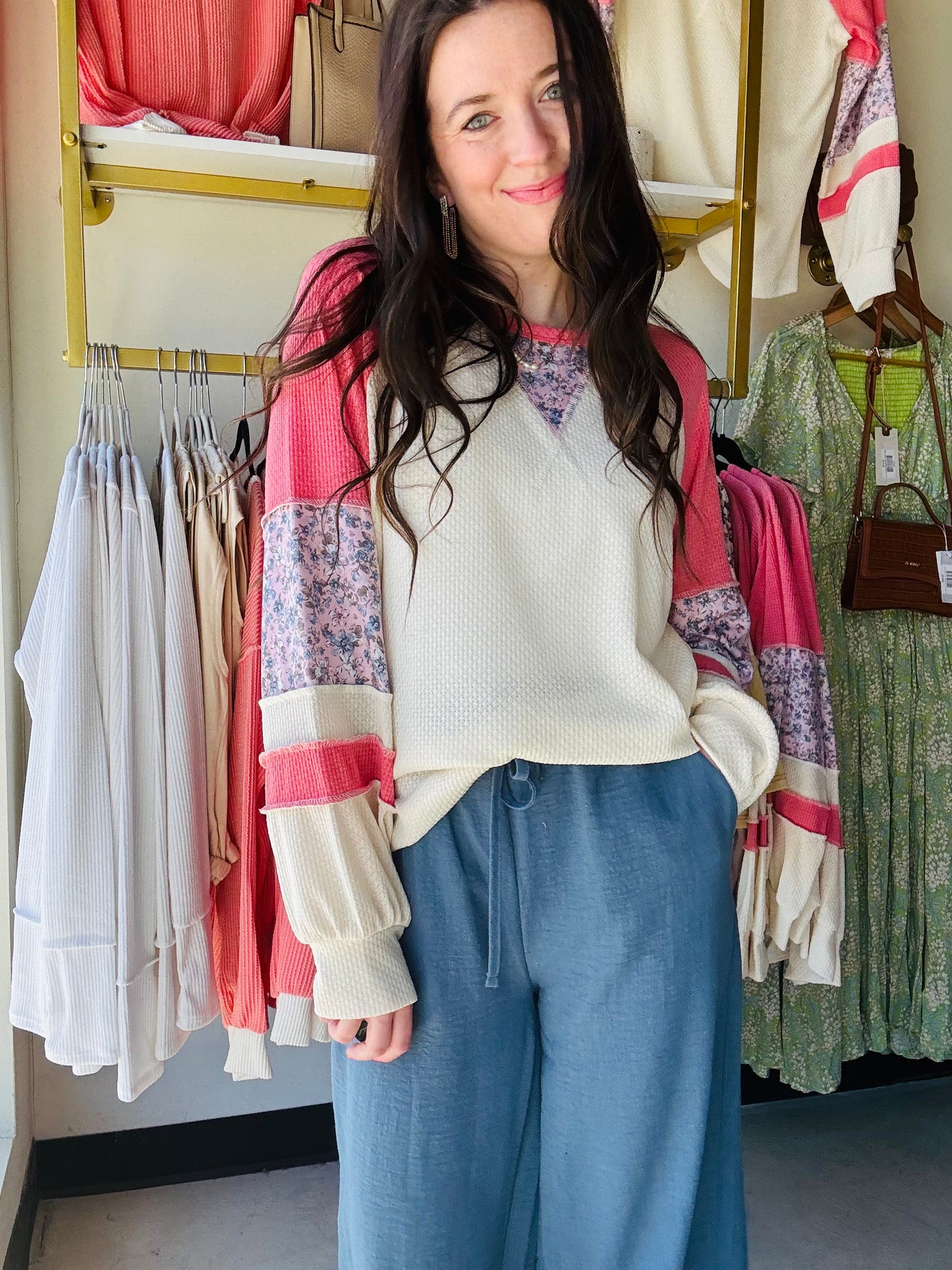 7th Ray
Get ready to bloom with style in our Floral Contrast Raglan Sleeve Top! This waffle knit top features a unique floral contrast, eye-catching color block design, and comfortable relaxed fit. With long raglan sleeves and bishop sleeve details, you'll be looking effortlessly fashionable.