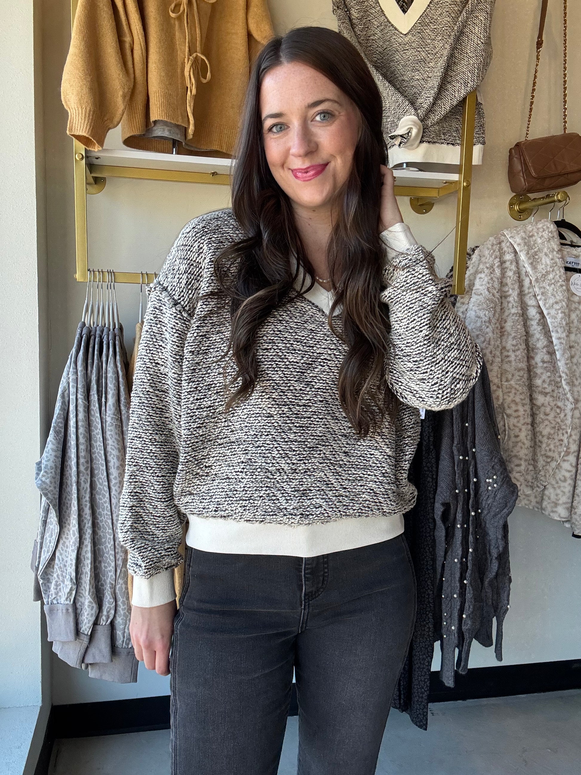 Tribal
Cozy up in this Cream Textured Knit Sweater featuring a chic V-neckline and playful drop shoulders for an effortlessly stylish look. The long sleeves and ribbed details at the cuffs, hem, and neckline add a snug touch, while the two-tone textured knit brings fun depth and warmth to your outfit. Perfect for layering or wearing solo on breezy days!