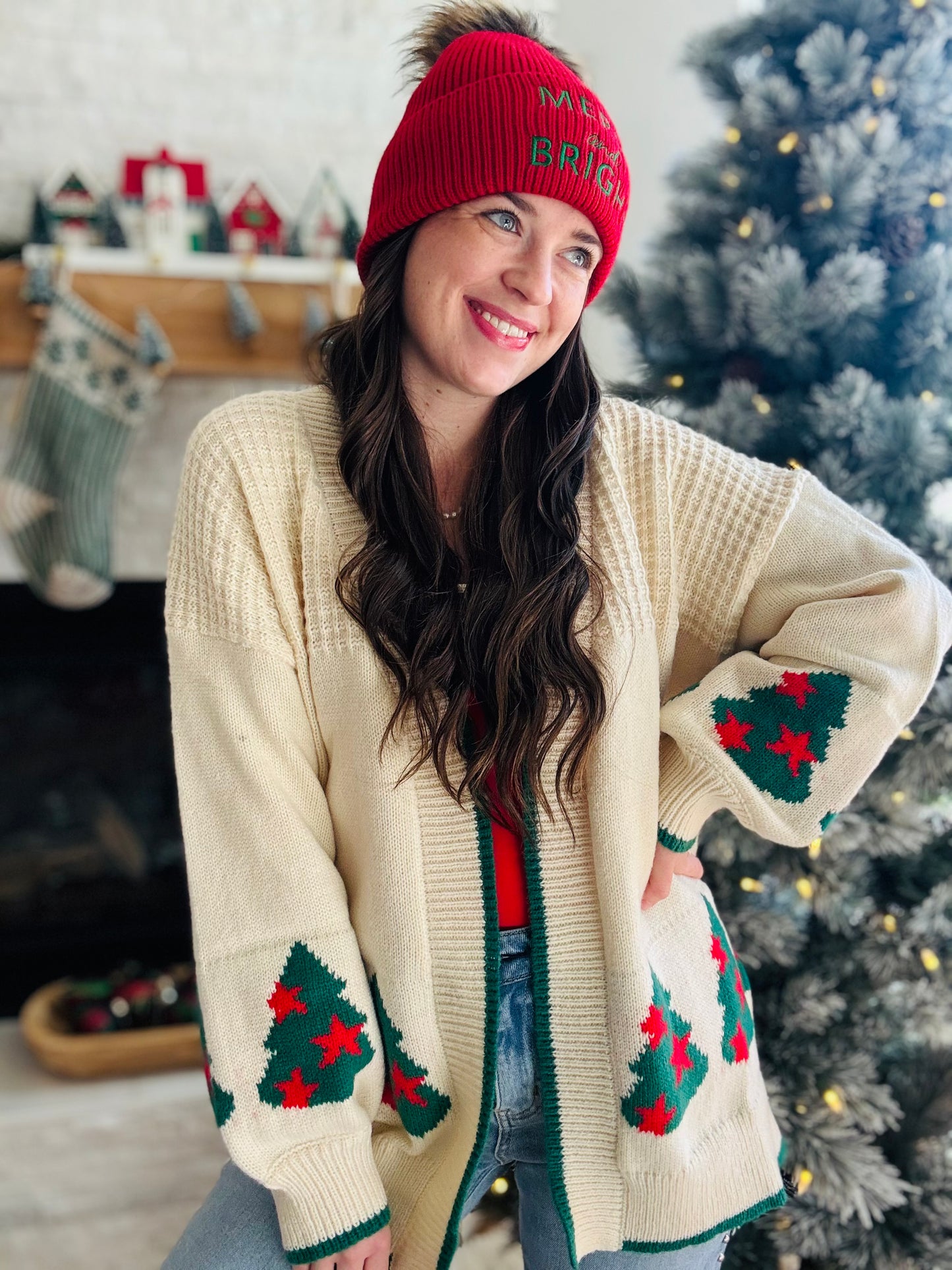 Wrap yourself in holiday cheer with this charming cream cardigan featuring festive Christmas trees adorned with twinkling stars. The playful design is elevated by crisp green trim detailing that frames the neckline and cuffs, while cozy ribbed fabric throughout adds texture and comfort. Perfect for spreading seasonal joy whether you're decorating, gathering with loved ones, or simply embracing the festive spirit in style. A wardrobe essential that brings warmth and whimsy to your holiday rotation.
Fantasti