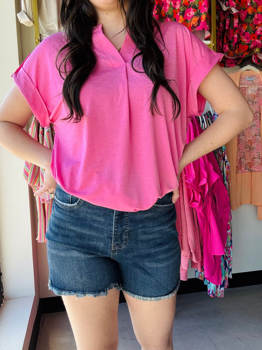 The Essential High Rise Fray Hem With Side Slits Shorts offer a flattering high-rise fit with built-in tummy control panels for a smooth, slimming silhouette. The frayed hem adds a relaxed, casual vibe, while the 1-button closure and zipper ensure a secure, comfortable fit. Crafted from premium fabric with the perfect amount of stretch, these shorts move with you, providing all-day comfort and shape retention. They effortlessly pair with your favorite wardrobe staples, making them a season-ready essential.