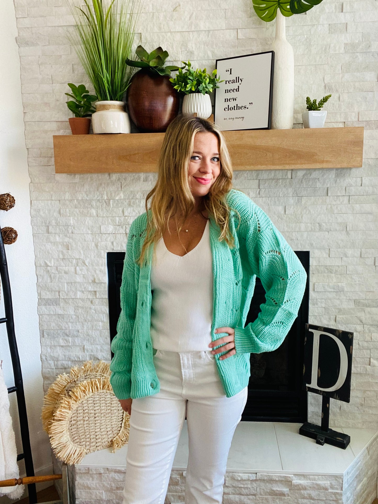 This Green Wave Detail Cardigan Sweater is designed with a unique knit detail, perfect for summer layering. It features a beautiful green color and a classic button-up design. Its lightweight material makes it easy throw on for work with your white denim!