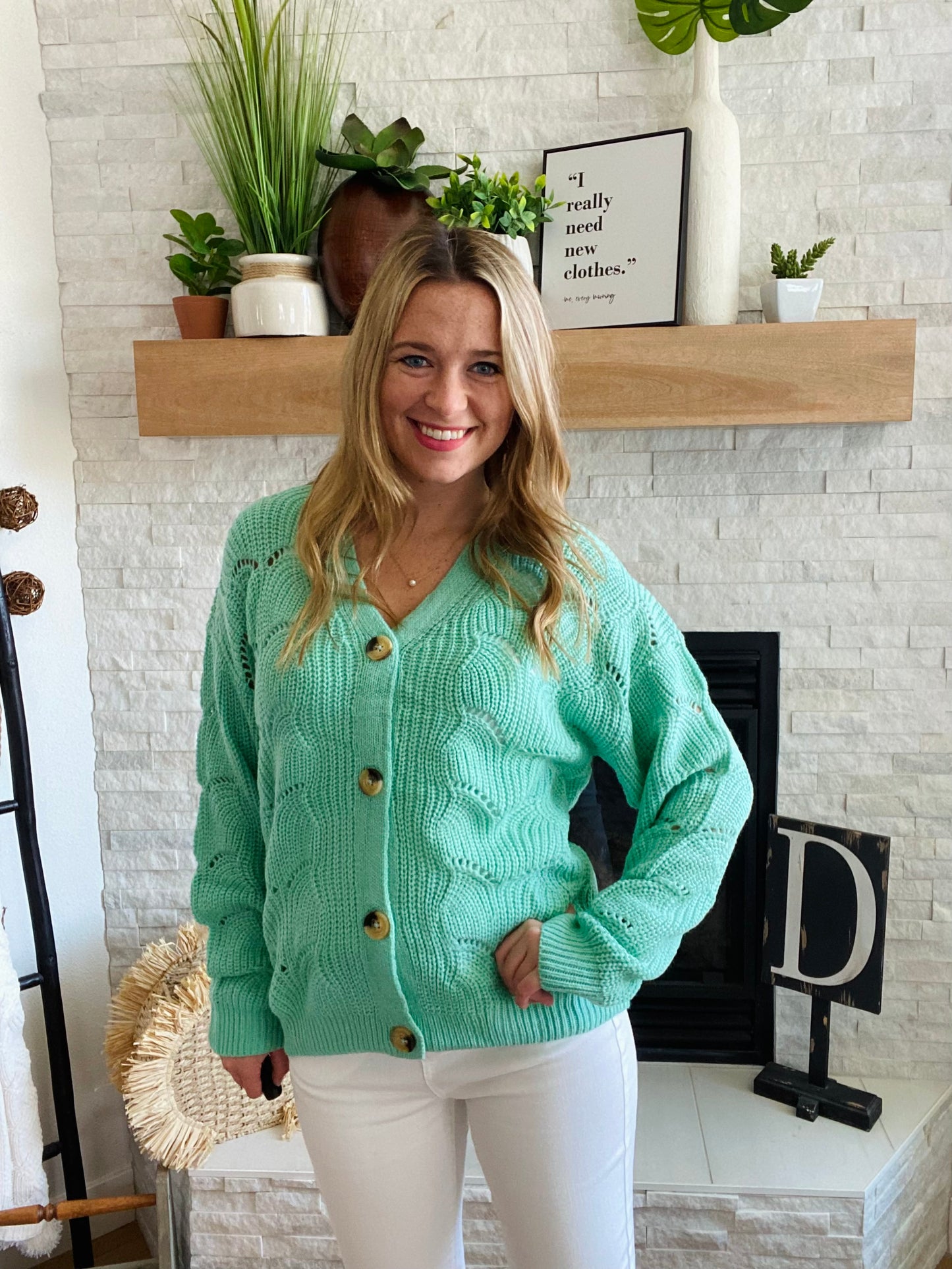 This Green Wave Detail Cardigan Sweater is designed with a unique knit detail, perfect for summer layering. It features a beautiful green color and a classic button-up design. Its lightweight material makes it easy throw on for work with your white denim!