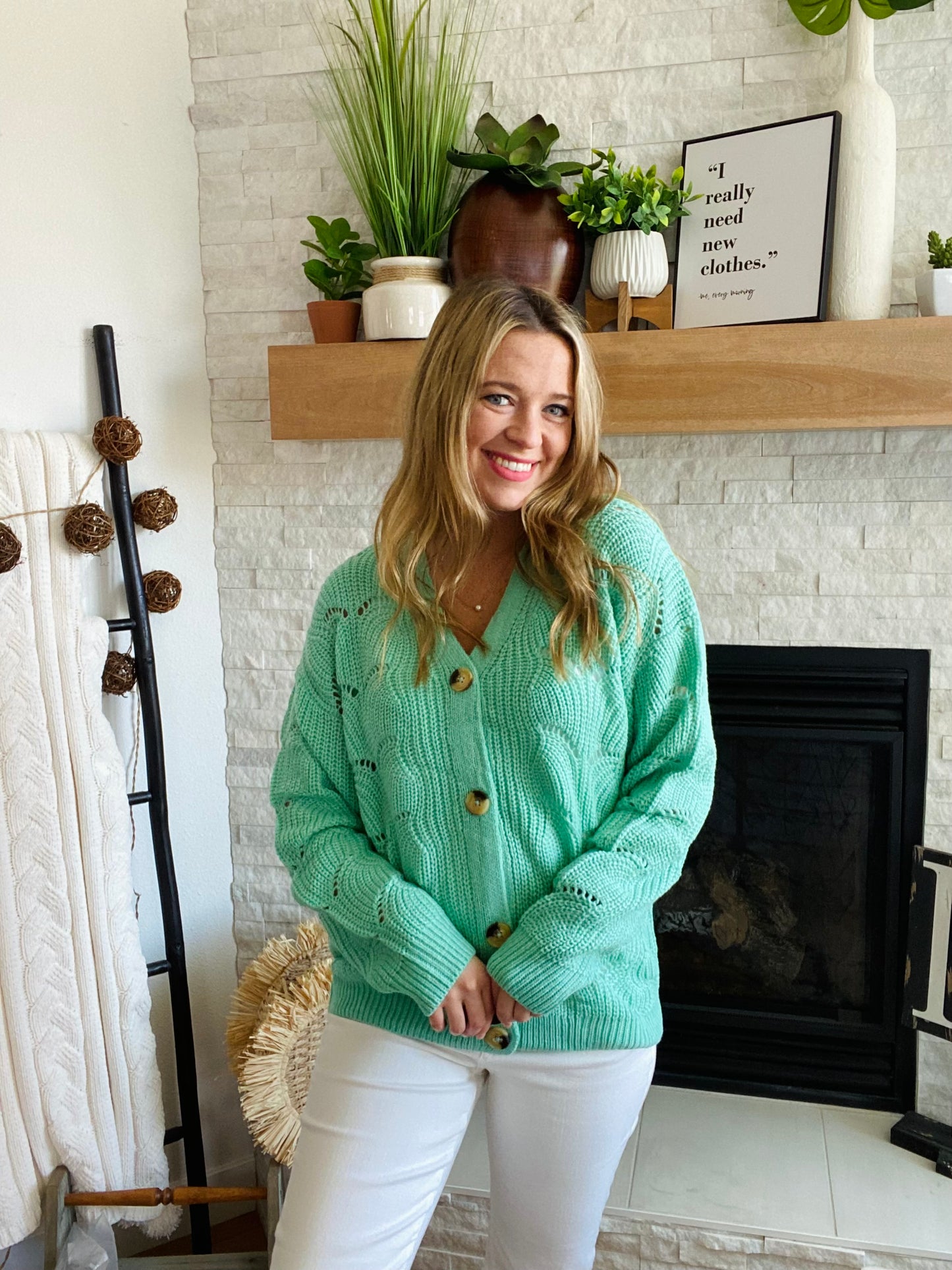 This Green Wave Detail Cardigan Sweater is designed with a unique knit detail, perfect for summer layering. It features a beautiful green color and a classic button-up design. Its lightweight material makes it easy throw on for work with your white denim!