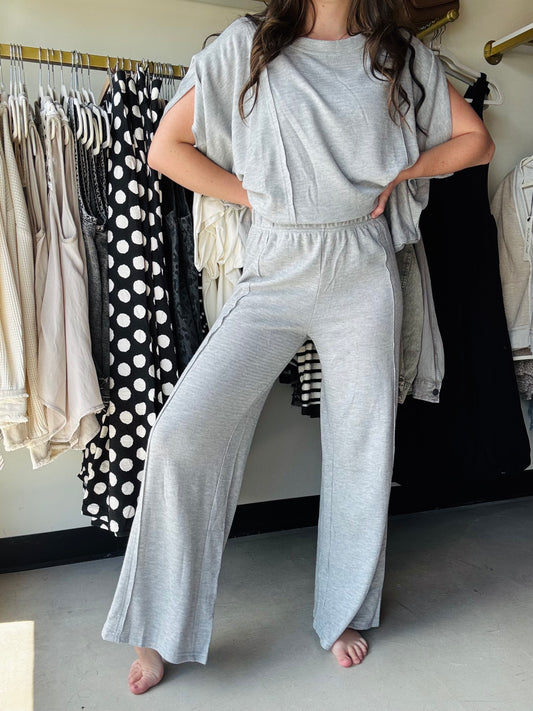 Umgee
These Grey Knit Wide Leg Pants bring cozy comfort with their soft knit fabric and breezy wide-leg fit. Unlined for a lightweight feel, they’re perfect for pairing with the matching dolman top to create a fun, relaxed look that’s ready for anything.
