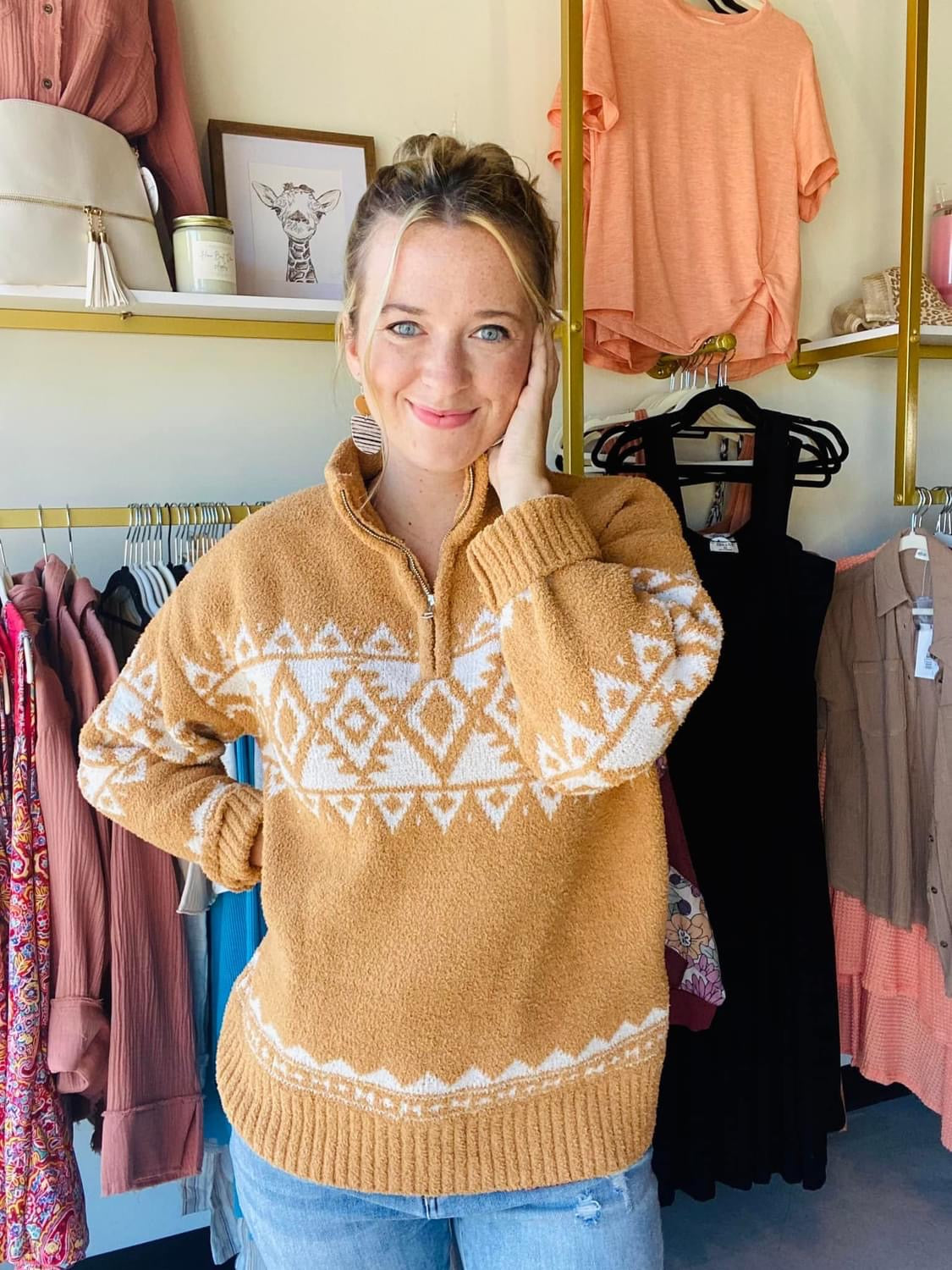 This classic Aztec Tan Zip Pullover boasts a buttery-soft material and a timeless aztec pattern, perfect for adding a cozy touch to your winter wardrobe. Its zip-up collar gives you the option of extra protection on the coldest days.