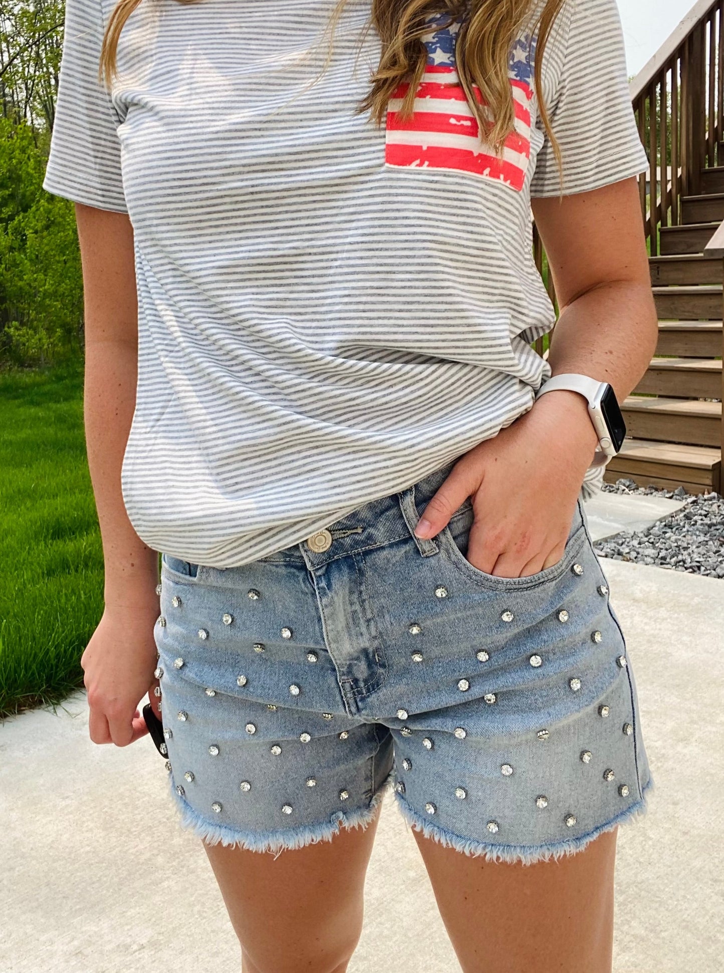 Turn heads in this sparkling denim shorts! The perfect piece to fulfill all of your rhinestone dreams! Wear them to your next concert, day out, or date night! The Reese features a mid rise fit, a frayed hem, and rhinestone studs. Hand Wash preferred