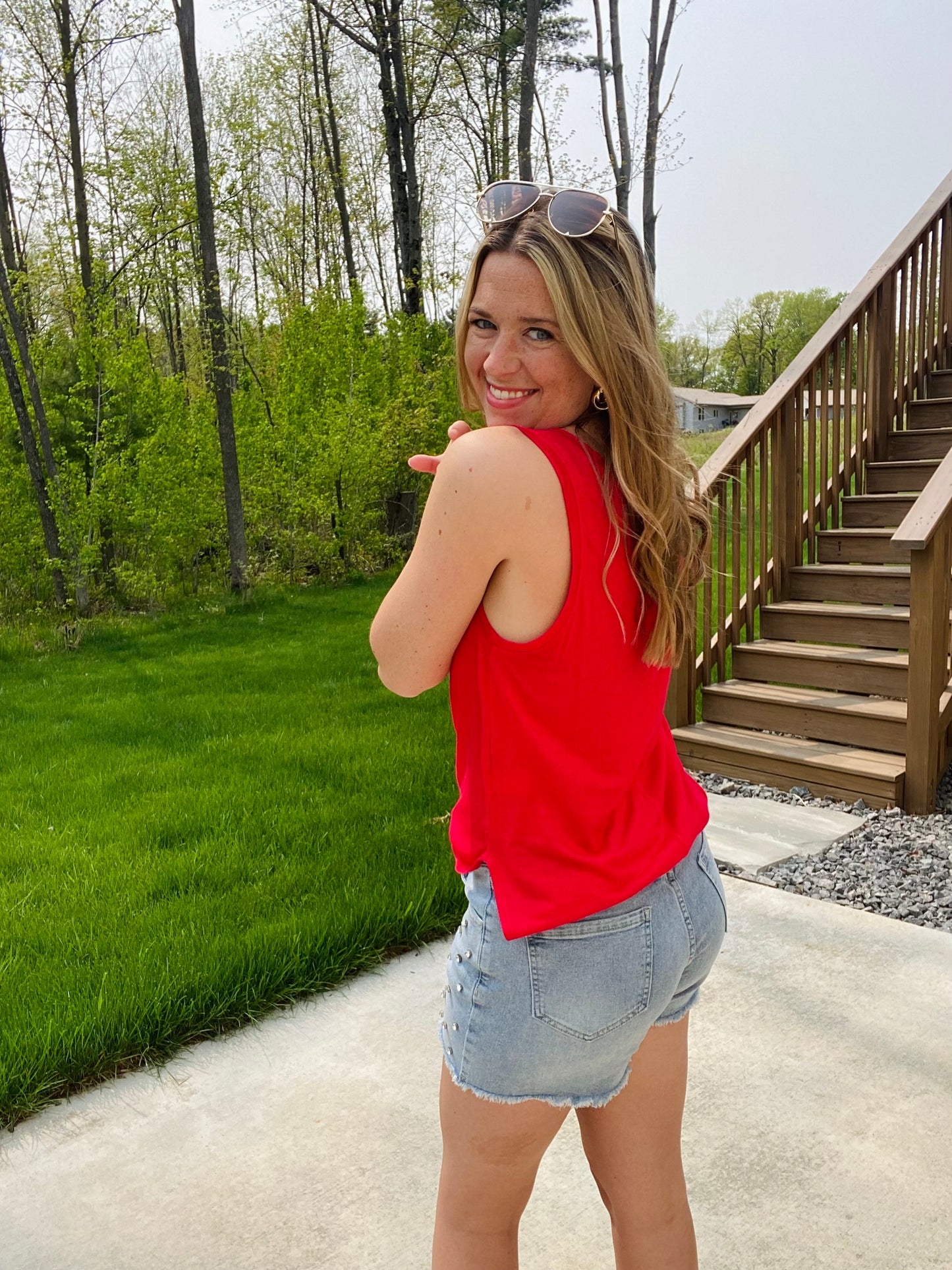 We know we're always on the lookout for a good, comfy basic! This tank is definitely one of those pieces! It's comfy and a relaxed fit that makes it so easy to wear and the neutral colors make styling and layering it a breeze! This top features a sleeveless style, a v-neck neckline, side slits, a back center seam and a rounded, hi-lo hemline.