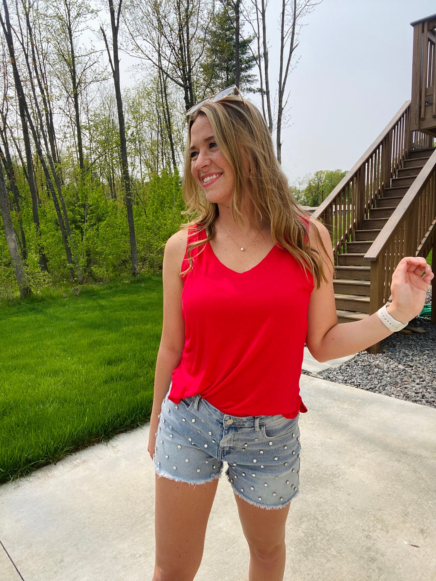 We know we're always on the lookout for a good, comfy basic! This tank is definitely one of those pieces! It's comfy and a relaxed fit that makes it so easy to wear and the neutral colors make styling and layering it a breeze! This top features a sleeveless style, a v-neck neckline, side slits, a back center seam and a rounded, hi-lo hemline.
