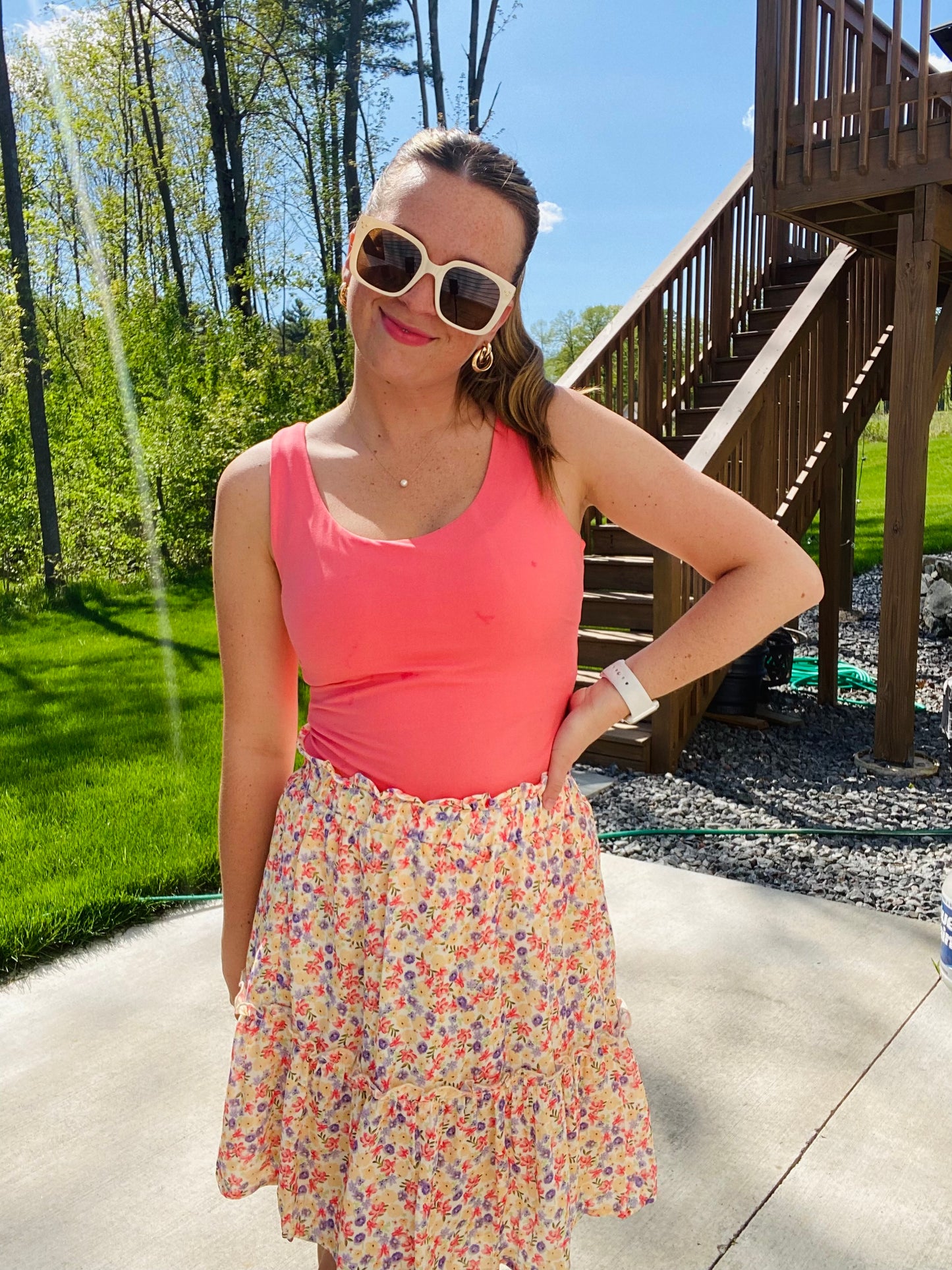 This Summer Garden Tiered Skirt is perfect for both office and leisure situations. The skirt features an elastic waist for comfort and light weight fabric for breathability and ease. With its modest length and feminine style, you can stay cool and classy throughout the day.