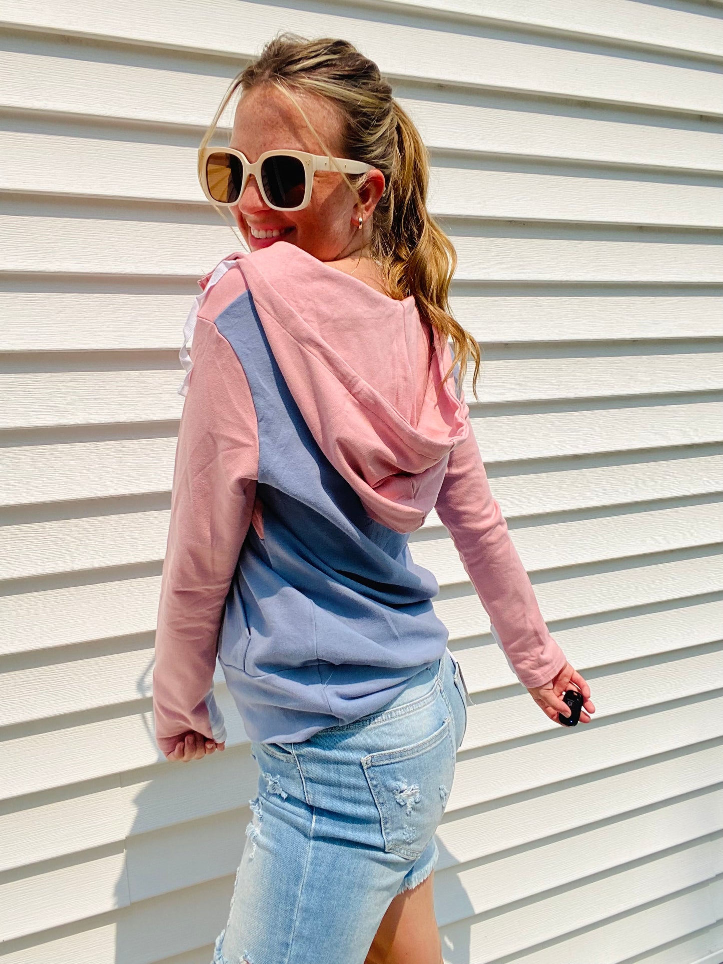 Stay warm and stylish with the Pink and Blue Block Zip Hoodie. Crafted with comfortable materials, this hoodie features contrasting colors, a half zipper, white cuff accents, and an oversized hood. Perfect for chilly days and nights - stay cozy in style!