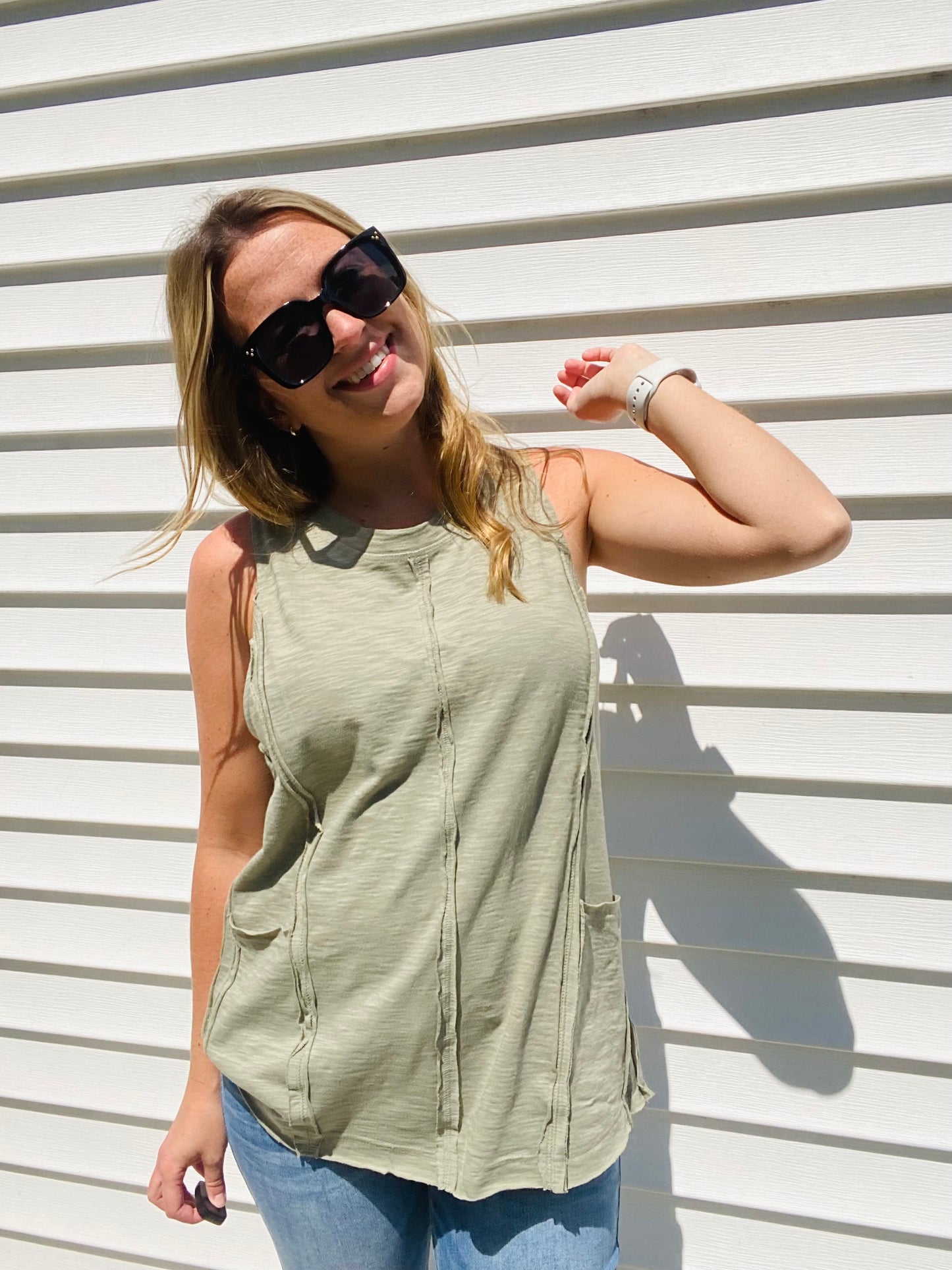 This Olive Exposed Seam Tank Top is the perfect pick for a stylish-yet-casual look. Featuring multi-seam detailing, raw edge neck and hem finishing, and side front pockets, this tank top will be your go-to for effortless, everyday style. The round neck ensures a classic look. Branded: Very J