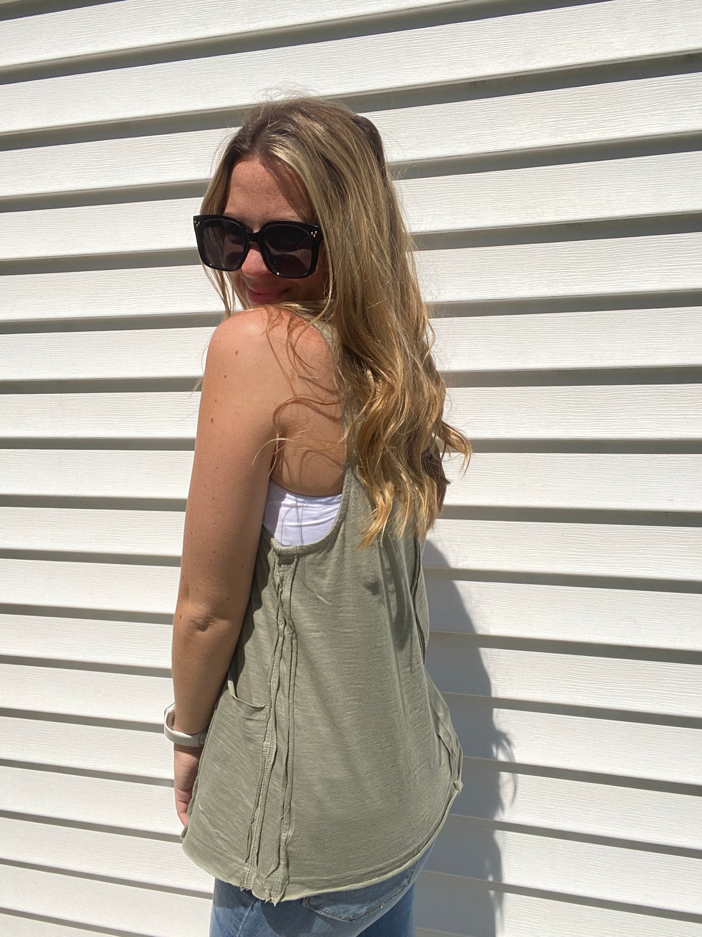 This Olive Exposed Seam Tank Top is the perfect pick for a stylish-yet-casual look. Featuring multi-seam detailing, raw edge neck and hem finishing, and side front pockets, this tank top will be your go-to for effortless, everyday style. The round neck ensures a classic look. Branded: Very J