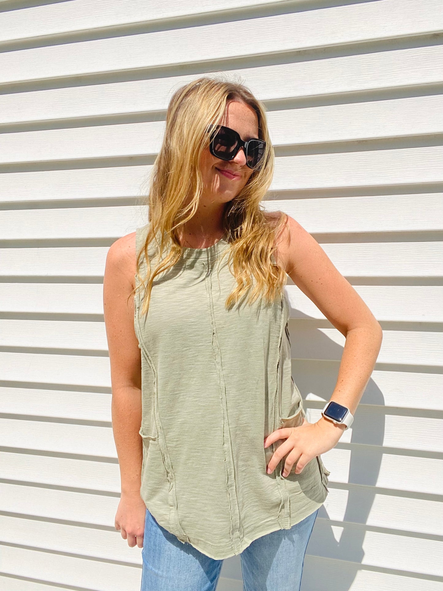 This Olive Exposed Seam Tank Top is the perfect pick for a stylish-yet-casual look. Featuring multi-seam detailing, raw edge neck and hem finishing, and side front pockets, this tank top will be your go-to for effortless, everyday style. The round neck ensures a classic look. Branded: Very J