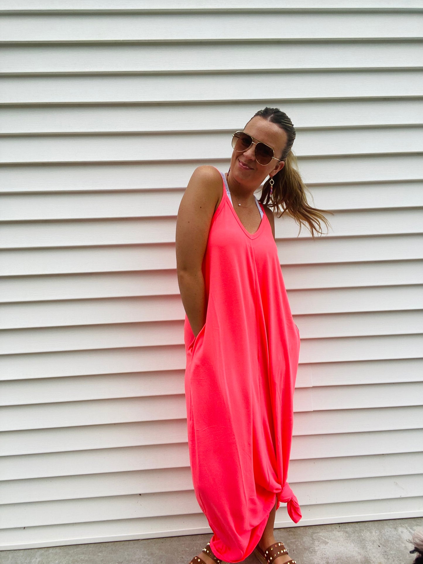 This Cami Maxi Dress is crafted from a blend of 57% polyester, 38% rayon and 5% spandex. Its side pockets, adjustable spaghetti straps and flowy fit provide a comfortable, stylish look. Model Sophie is 5'4" and wearing a size small. This is the ultimate "Airplane outfit" or "Sunburn outfit" of you know what I mean!