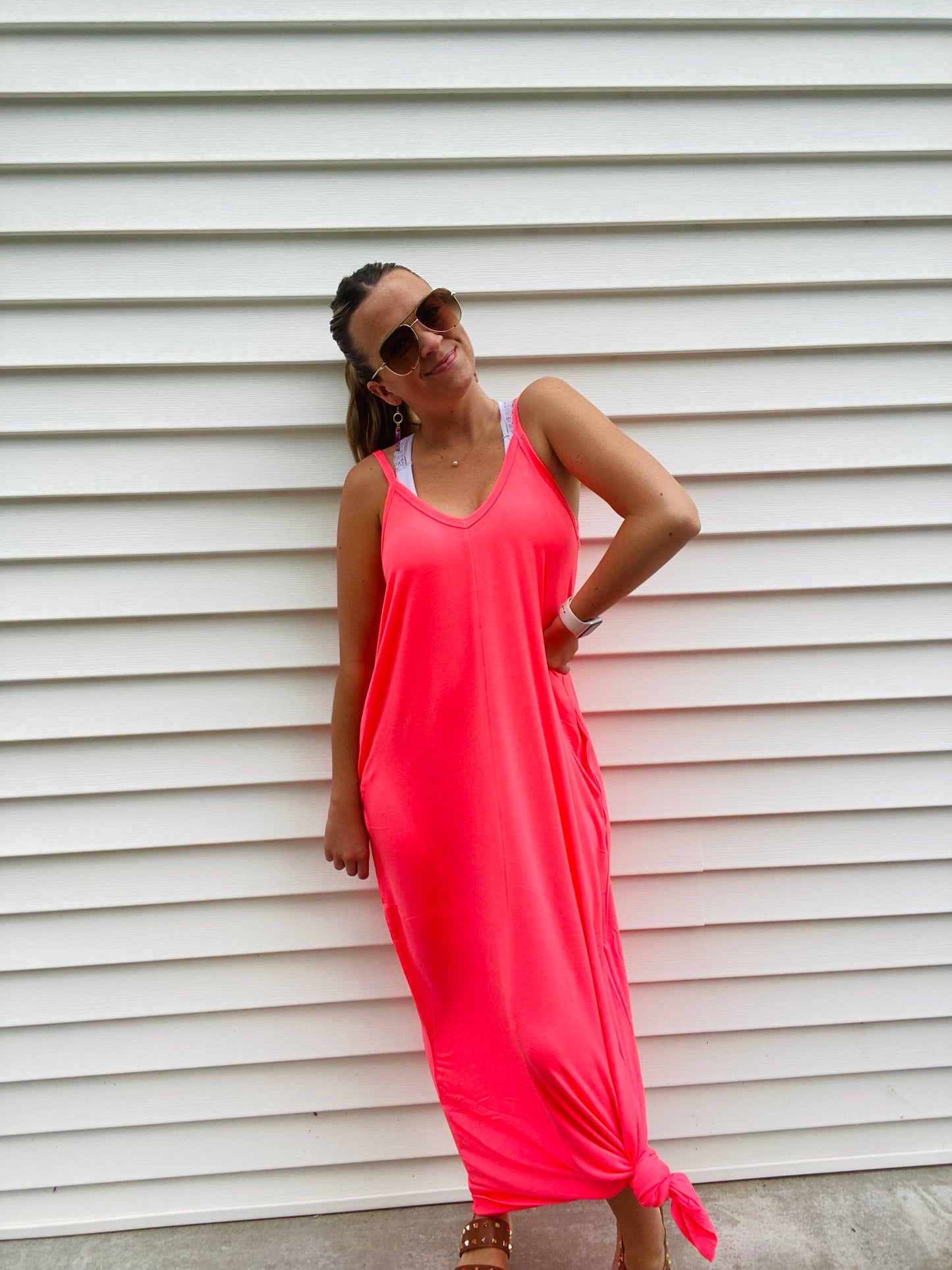 This Cami Maxi Dress is crafted from a blend of 57% polyester, 38% rayon and 5% spandex. Its side pockets, adjustable spaghetti straps and flowy fit provide a comfortable, stylish look. Model Sophie is 5'4" and wearing a size small. This is the ultimate "Airplane outfit" or "Sunburn outfit" of you know what I mean!