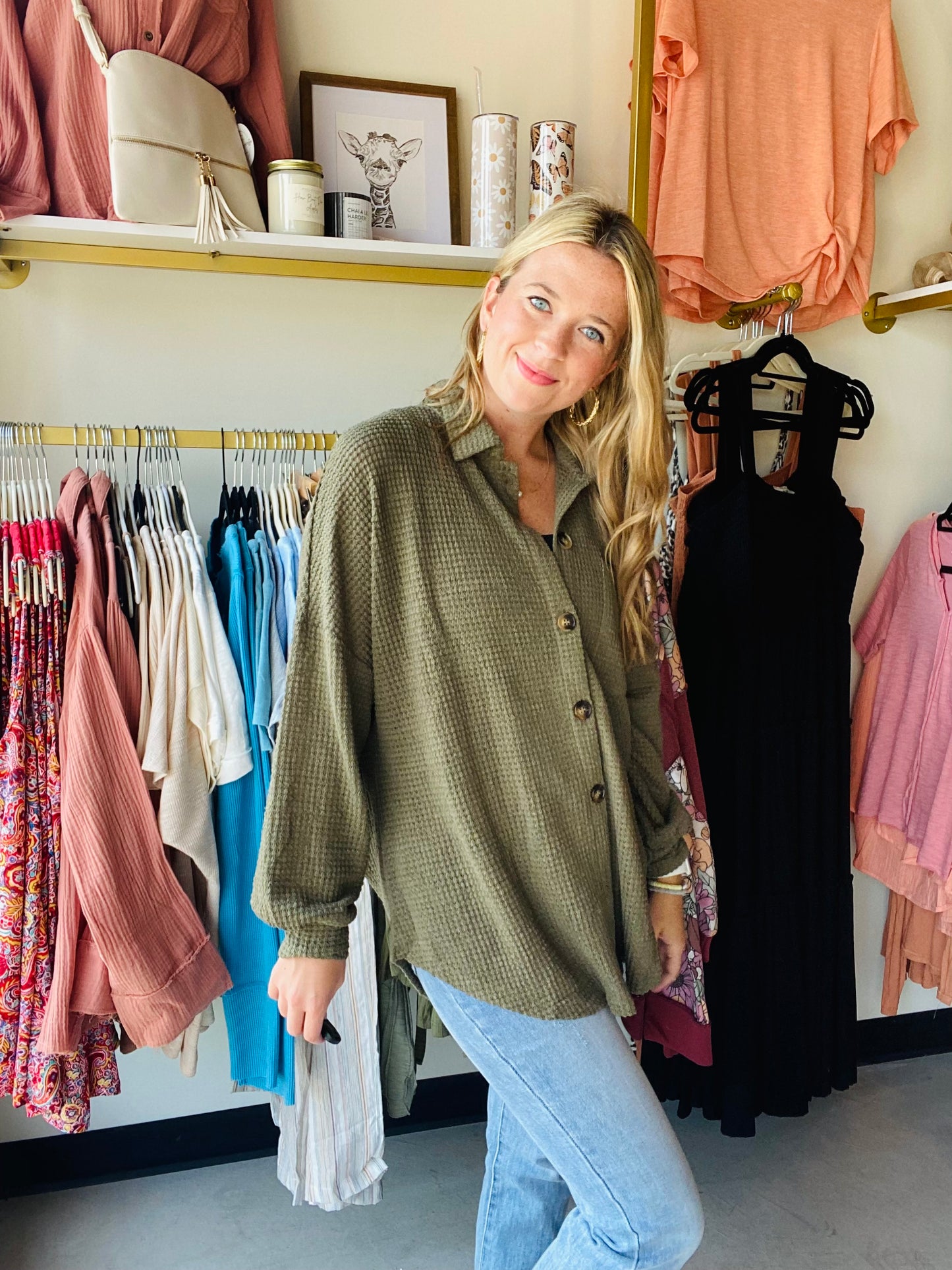 Introducing the Olive Waffle Knit Lightweight Shacket - perfect for easy, casual style. Crafted from lightweight material with waffle knit texturing and a dropped shoulder silhouette, this shacket is designed for comfort and breathability. Button up front, a collared neckline and a single accent chest pocket complete the look. Enjoy the relaxed, comfortable fit that ends in a rounded hemline.