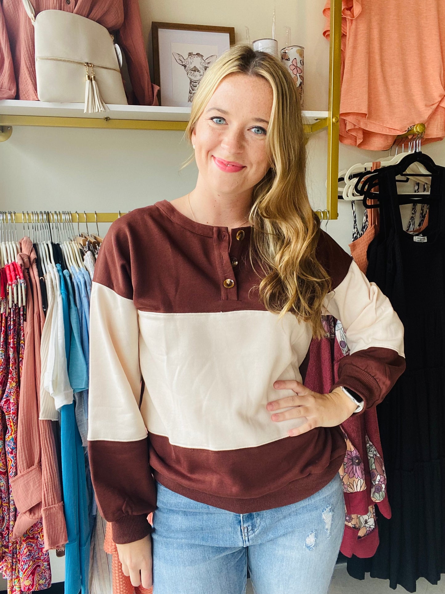 Stay warm and stylish in any season with this Khaki and Brown Colorblock Sweatshirt. Crafted from a cozy fabric and featuring a ribbed trim and round neckline, this sweatshirt is both comfortable and fashionable. The three button detail and perfect fall colors add the perfect touch to complete the look. Dress it up with denim for a casual and put-together style.