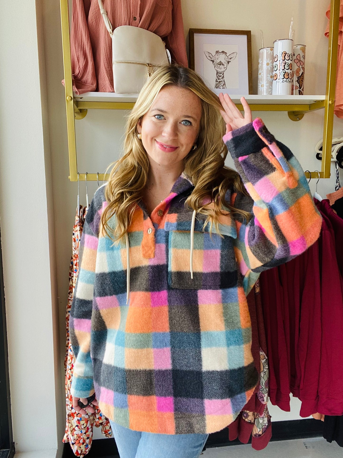This Multi Checker hoodie is sure to be a must-have for the season! It comes in trending colors for fall and is made of brushed fleece with functioning buttons and a breast pocket. The oversized fit gives a comfortable and relaxed look. Stay warm and fashionable with this stylish hoodie. Bibi Brand