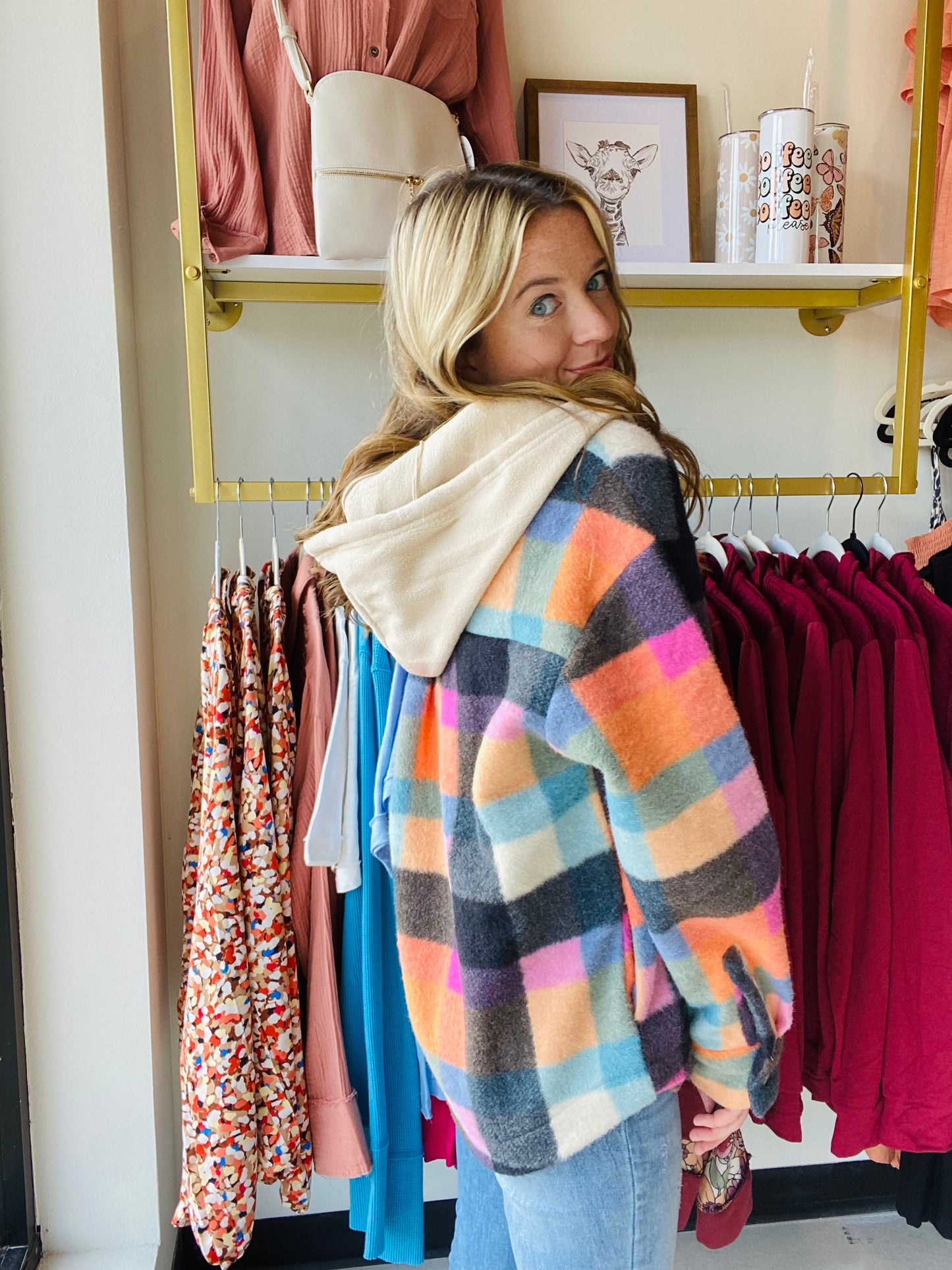 This Multi Checker hoodie is sure to be a must-have for the season! It comes in trending colors for fall and is made of brushed fleece with functioning buttons and a breast pocket. The oversized fit gives a comfortable and relaxed look. Stay warm and fashionable with this stylish hoodie. Bibi Brand