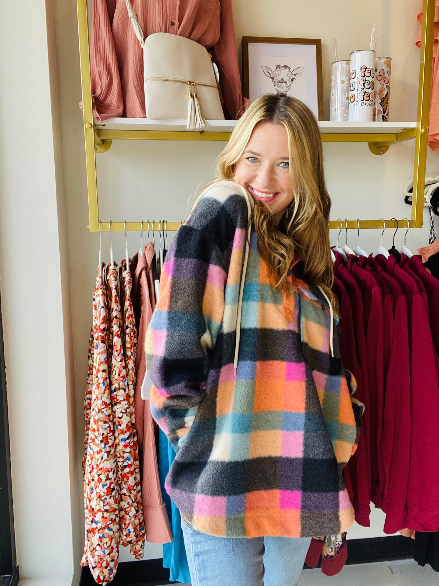 This Multi Checker hoodie is sure to be a must-have for the season! It comes in trending colors for fall and is made of brushed fleece with functioning buttons and a breast pocket. The oversized fit gives a comfortable and relaxed look. Stay warm and fashionable with this stylish hoodie. Bibi Brand