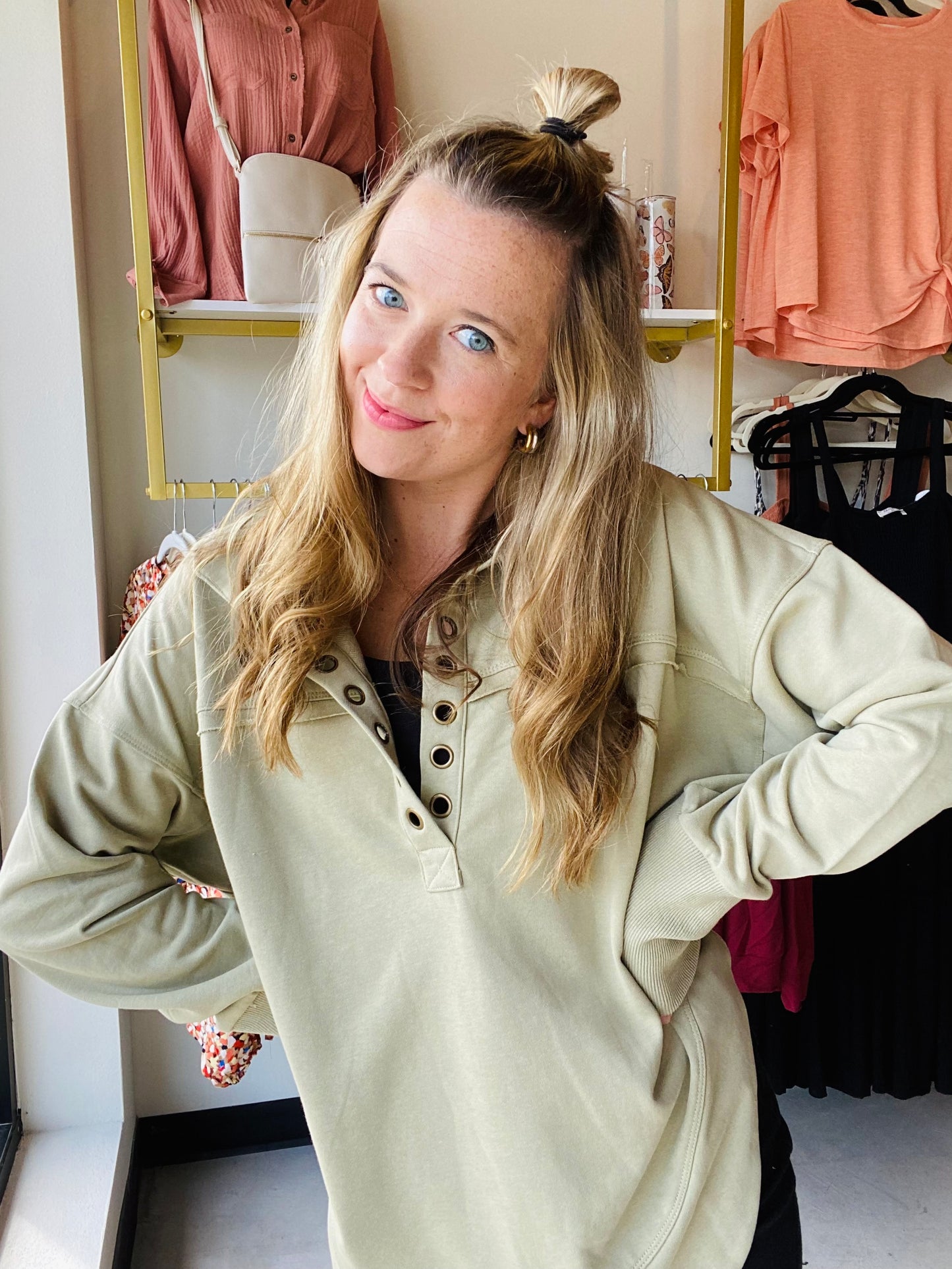 Experience comfort and style with this Ash Green Deep V Cuff Pullover. It has a vintage wash finish to give you an effortless look paired with a unique ring detail for a subtle touch of style. Its versatile design allows you to pair it with yoga pants or jeans, making it perfect for both laid-back and casual. Bibi Brand