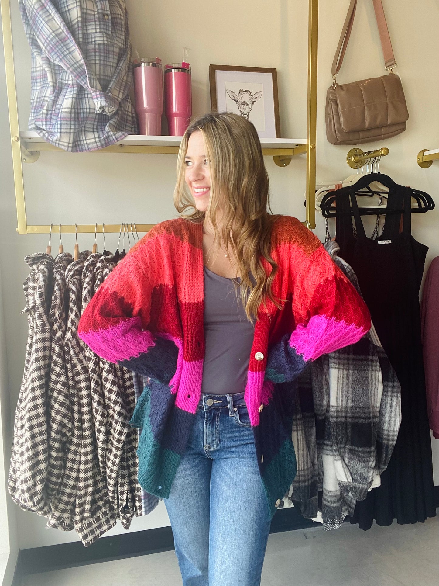This Chunky Honey Comb Sweater has a deep v neck and functioning buttons, giving it an elegant look. It comes in sleek jewel tone stripes and an oversized fit for added warmth in the cold months. Stay stylish and cozy with this high-quality sweater.