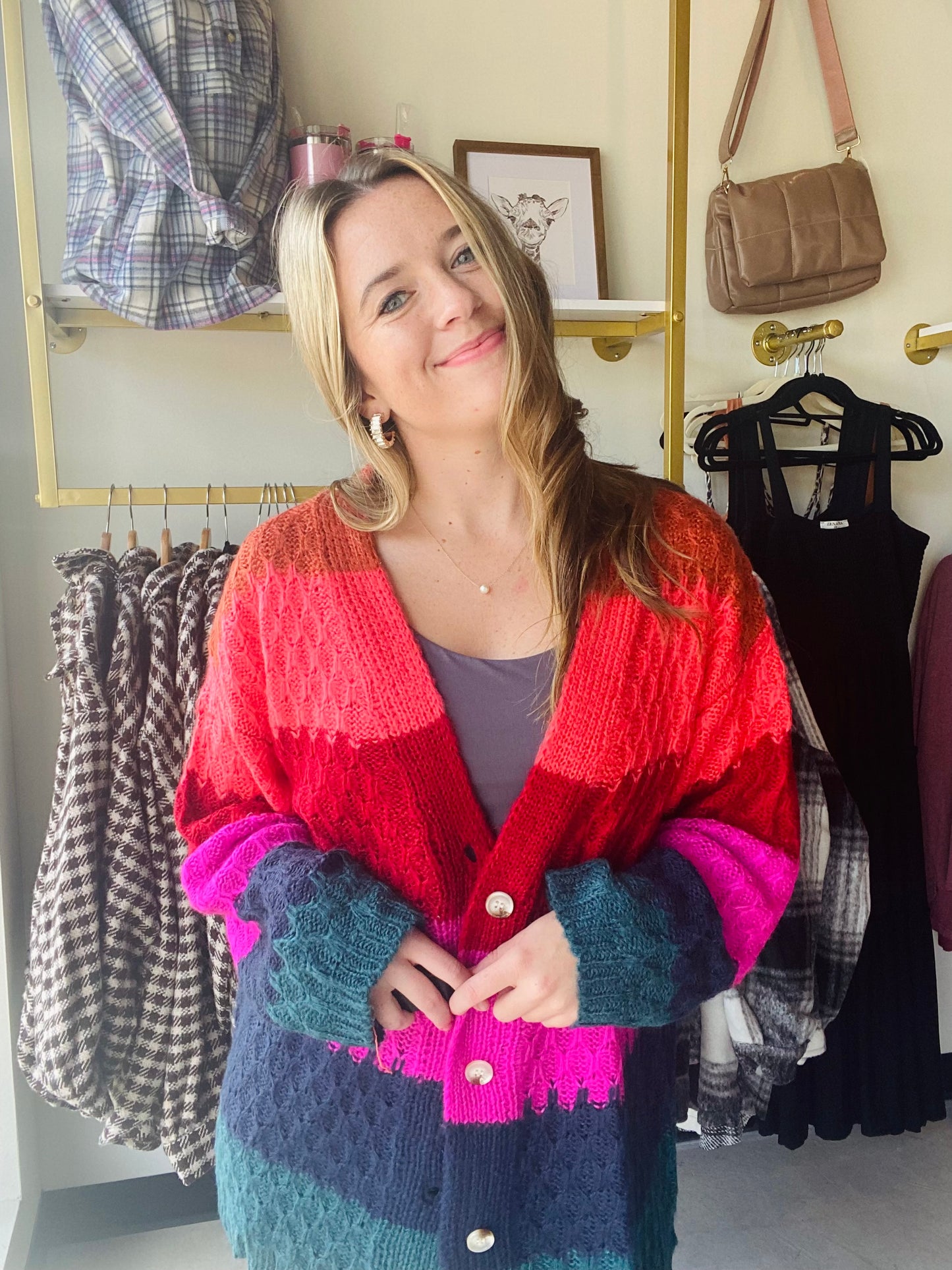 This Chunky Honey Comb Sweater has a deep v neck and functioning buttons, giving it an elegant look. It comes in sleek jewel tone stripes and an oversized fit for added warmth in the cold months. Stay stylish and cozy with this high-quality sweater.
