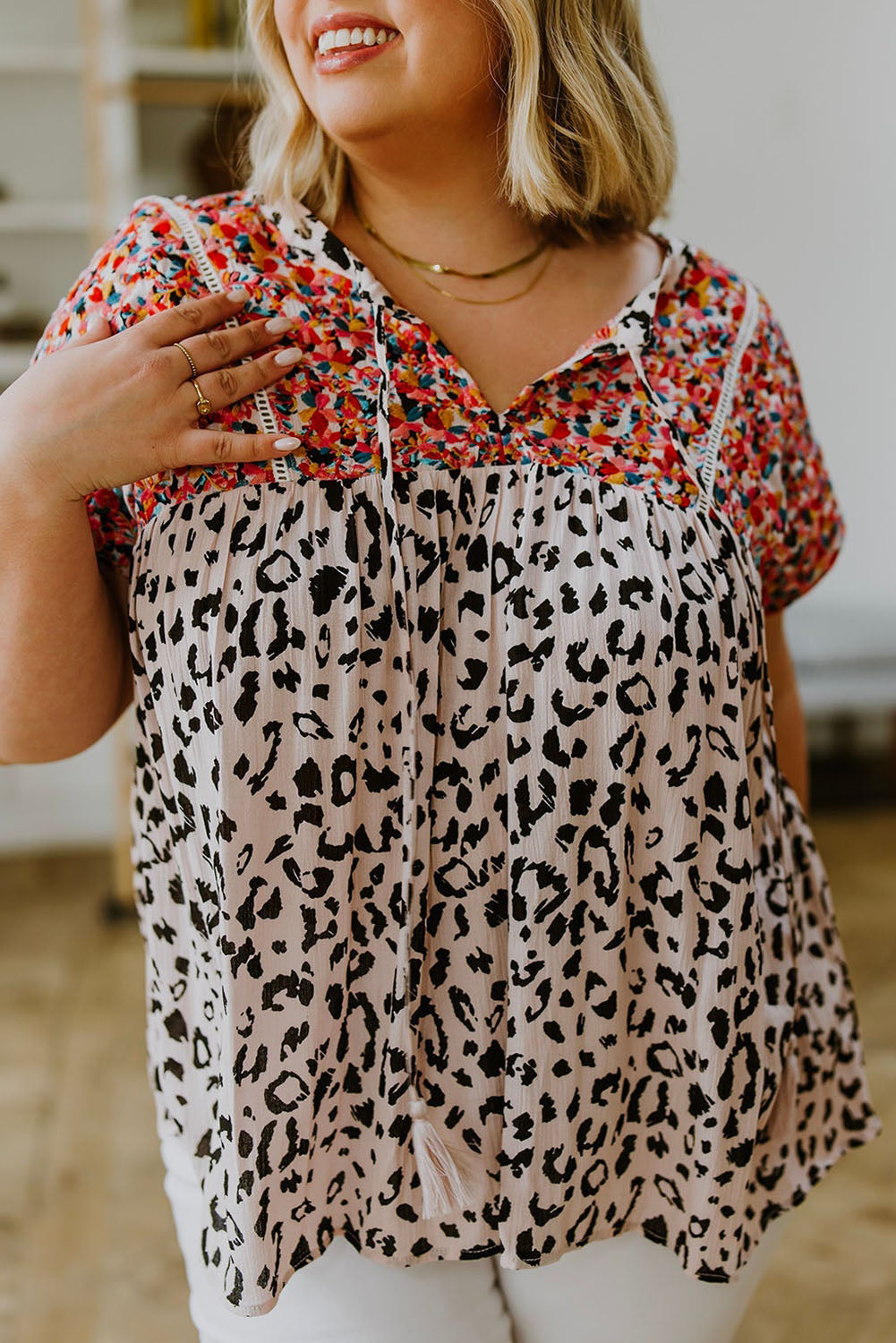 This plus-size blouse features a unique boho leopard print and classic tassel details. The lightweight shift silhouette is perfect for the office while the patchwork adds a touch of style. Perfect for everyday wear.