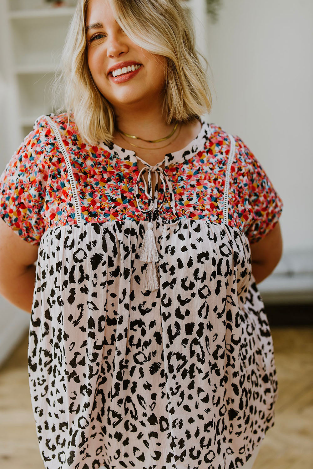 This plus-size blouse features a unique boho leopard print and classic tassel details. The lightweight shift silhouette is perfect for the office while the patchwork adds a touch of style. Perfect for everyday wear.