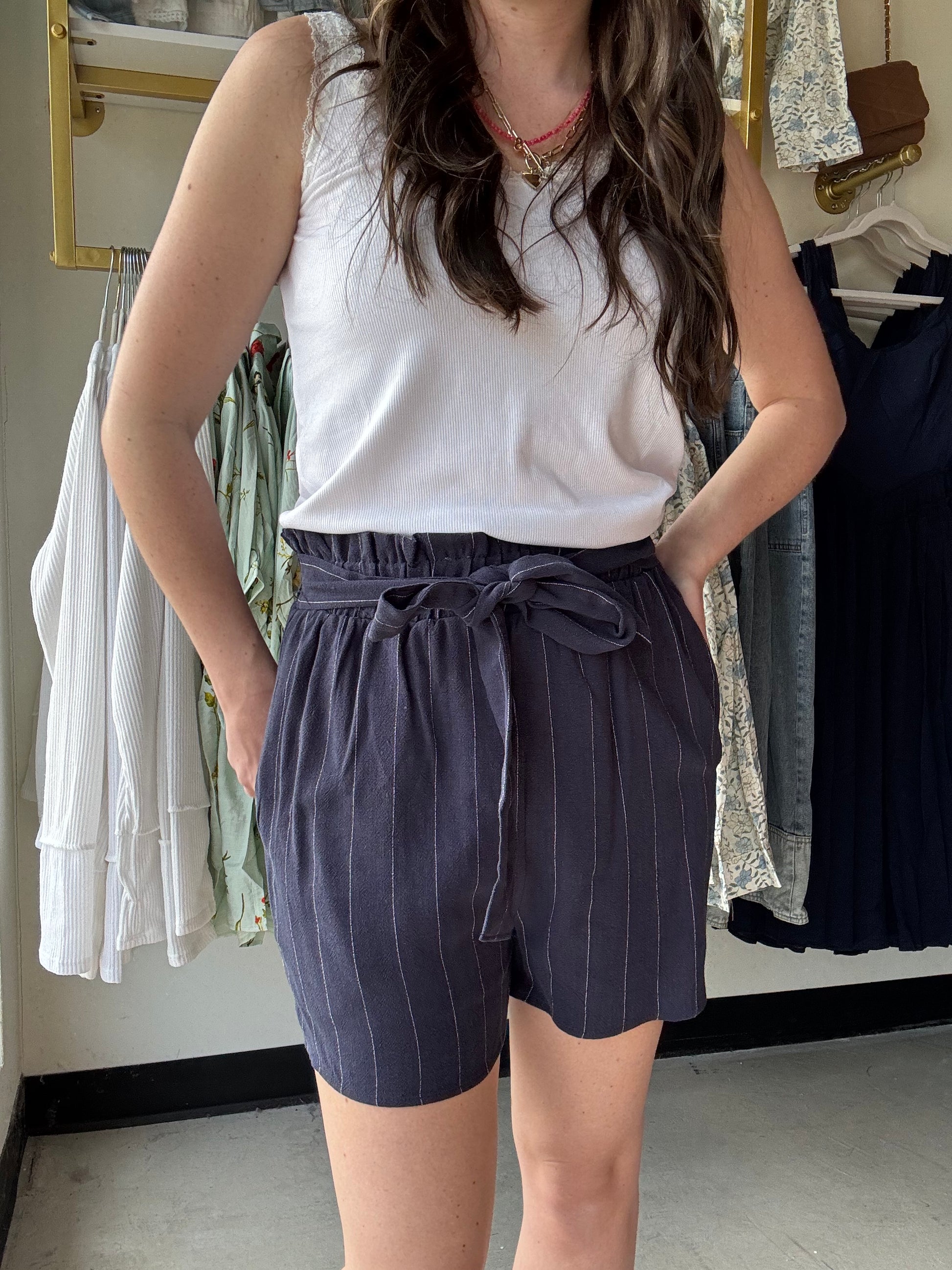 Michelle Mae
Stay cool and stylish this summer with our Libby Linen Shorts. Made from breathable linen, with a stretchy waistband and attached tie belt for a comfortable fit. Plus, pockets for added convenience. Perfect for any summer adventure.