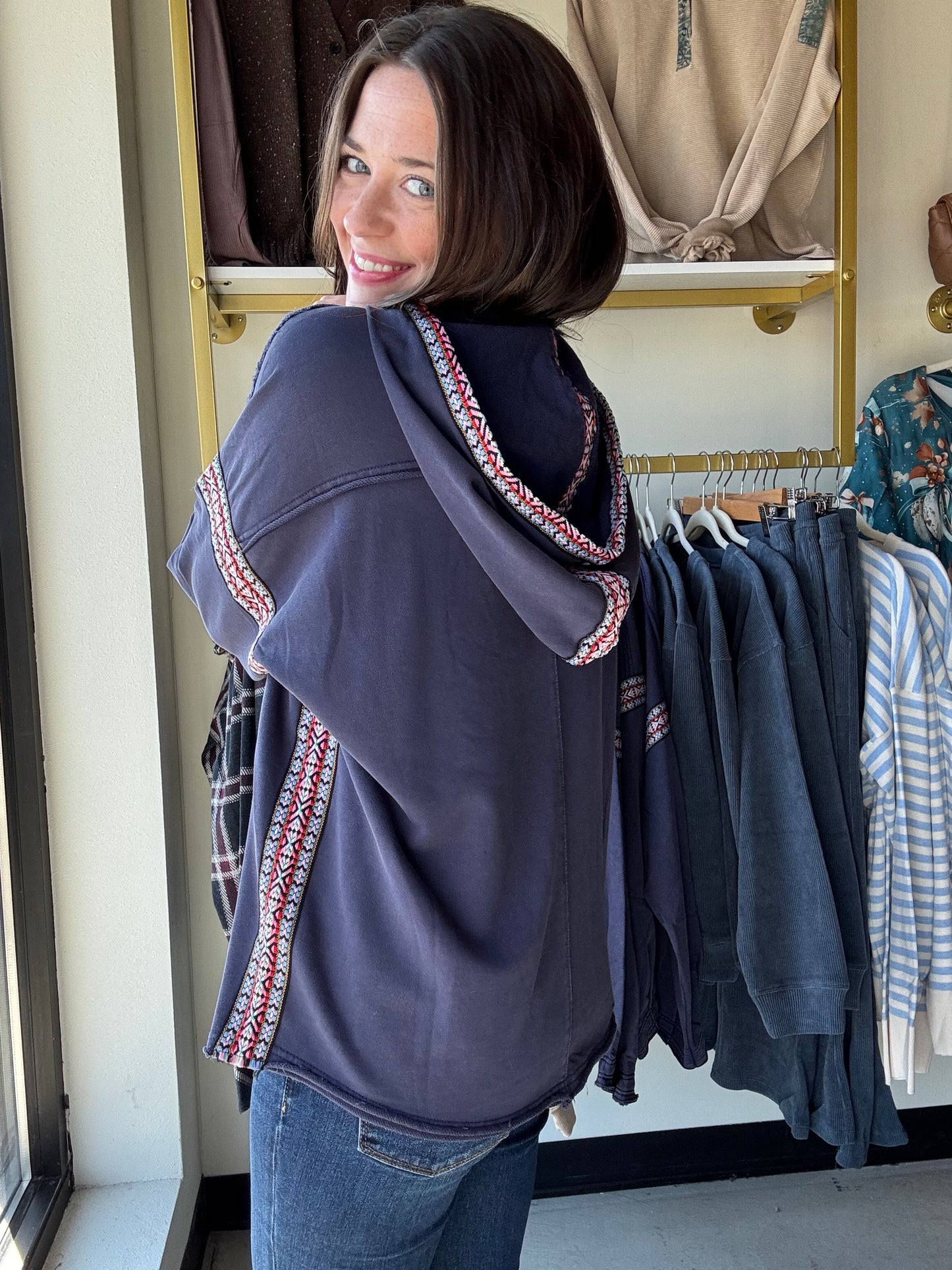 Easel
Embrace cozy vibes with this Navy Embroidered Trim Hoodie. Its relaxed, oversized fit and dropped shoulders ensure endless comfort, while the multicolor ethnic trim adds a fun pop of color. The attached hood tops off this laid-back look, perfect for playful days and chilly nights.