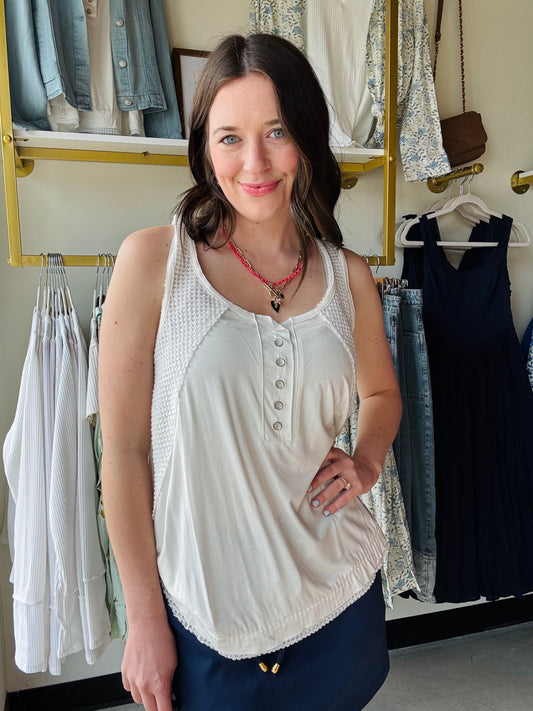 POL
Designed in round neck sleeveless top in pol jersey with thermal patch, out seam, half placket with metal button, thermal panel point, binding with edge cut detail, solid color.