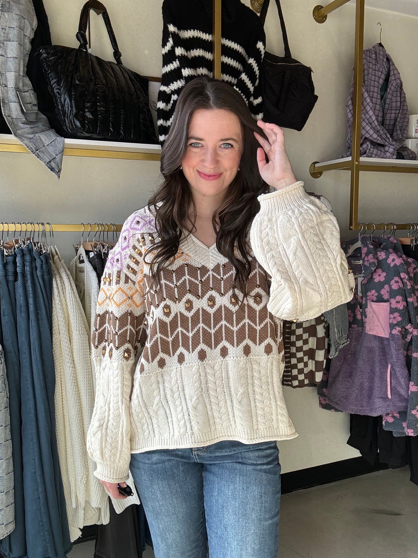 Get cozy in our Cable Knit Accent Stud Sweater! With a flattering V neckline and eye-catching brown, yellow, and purple design, this sweater adds a playful twist to your winter wardrobe. The brass stud detailing takes this cable knit sweater to the next level. 
Brand: POL