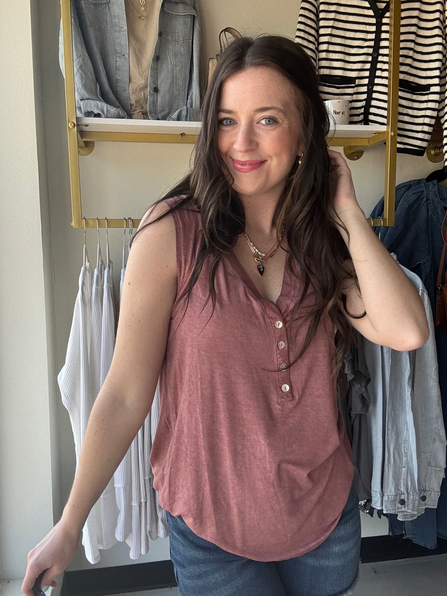 Be prepared for a great time under the sun with our Brick V Neck Button Tank. This sleeveless V-neck henley top is ideal for casual outings and is made from a comfy knit fabric. The addition of button detailing gives it a charming touch.