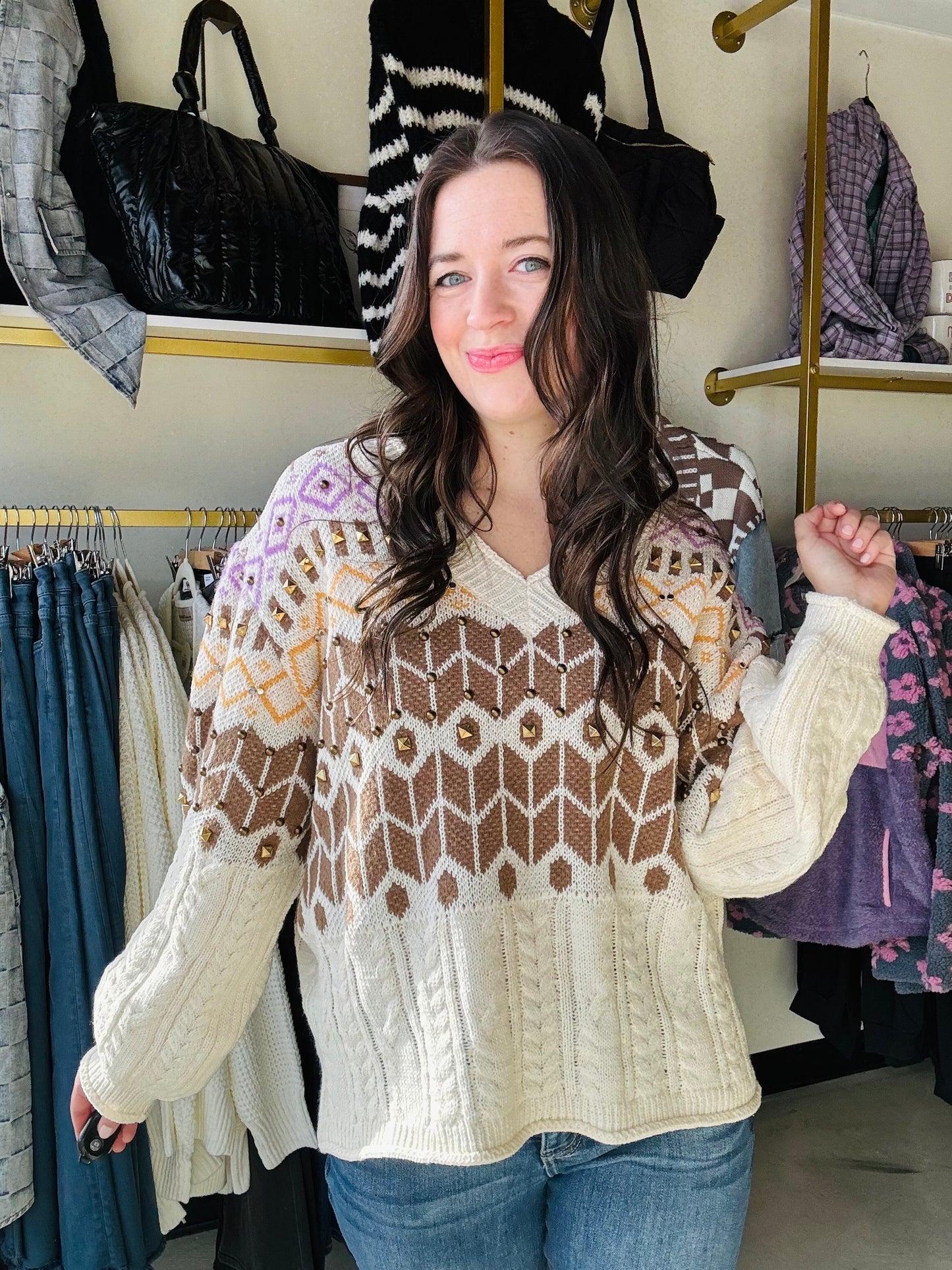 Get cozy in our Cable Knit Accent Stud Sweater! With a flattering V neckline and eye-catching brown, yellow, and purple design, this sweater adds a playful twist to your winter wardrobe. The brass stud detailing takes this cable knit sweater to the next level. 
Brand: POL