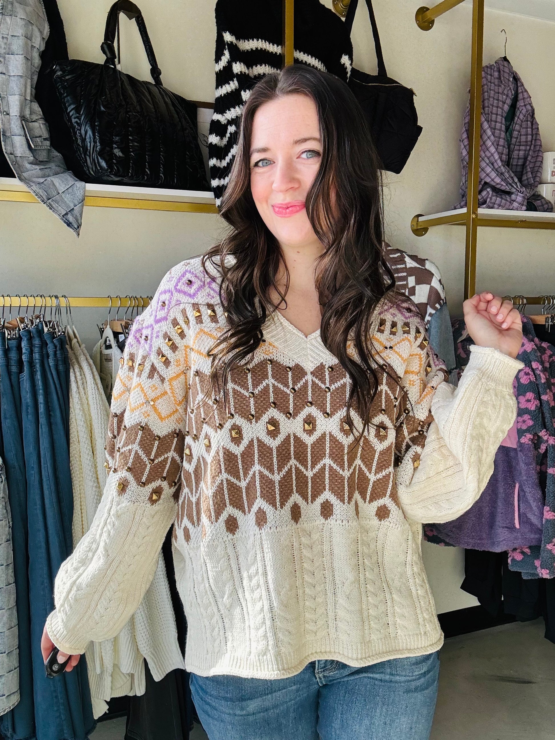 Get cozy in our Cable Knit Accent Stud Sweater! With a flattering V neckline and eye-catching brown, yellow, and purple design, this sweater adds a playful twist to your winter wardrobe. The brass stud detailing takes this cable knit sweater to the next level. 
Brand: POL
