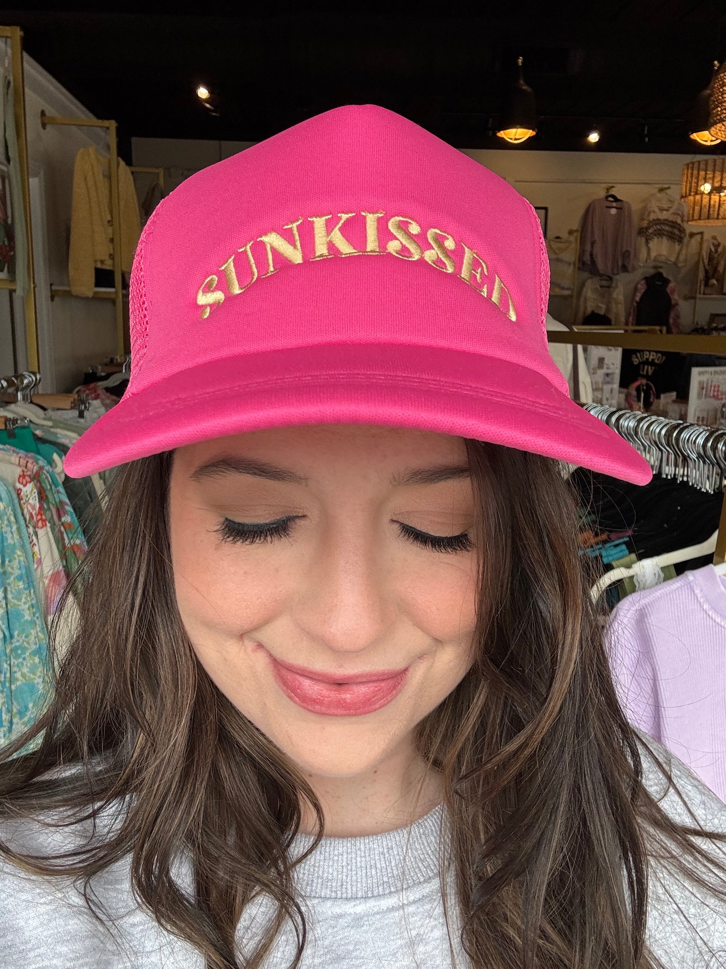 Panache Apparel
Pink trucker hat
Lt. yellow "SUNKISSED" embroidered on front
100% Polyester
Adjustable snapback closure
Breathable mesh