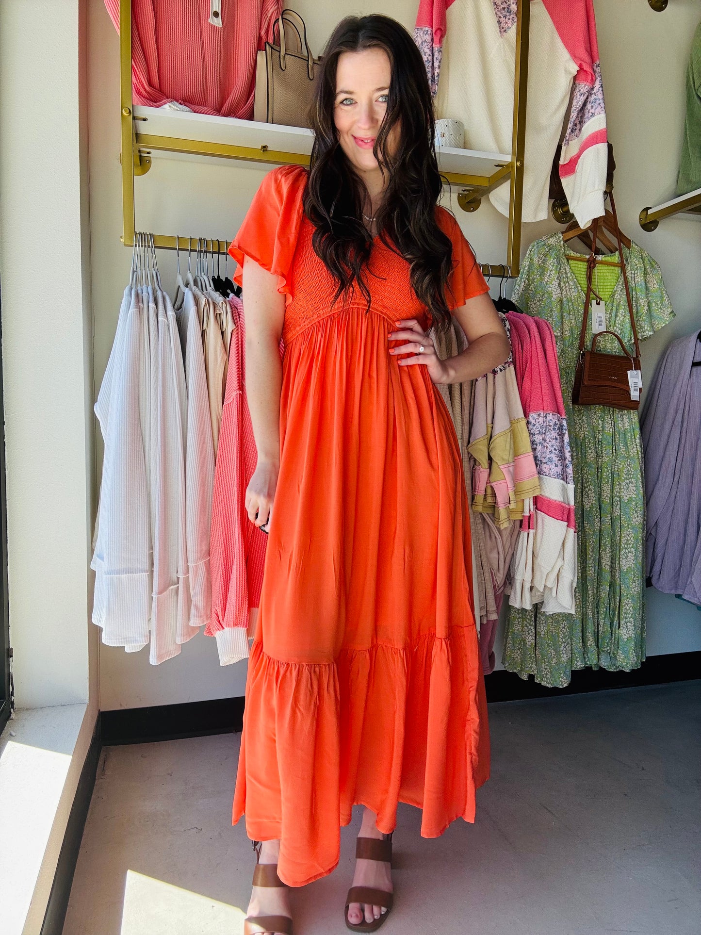 In Loom
Stay stylish and sustainable in our Sunset Orange Modal Smocked Dress! Made with our silky modal fabric, this best-selling dress features a smocked front and back bodice, flutter sleeves, and a flounced hem. Double lined for ultimate comfort and style. 