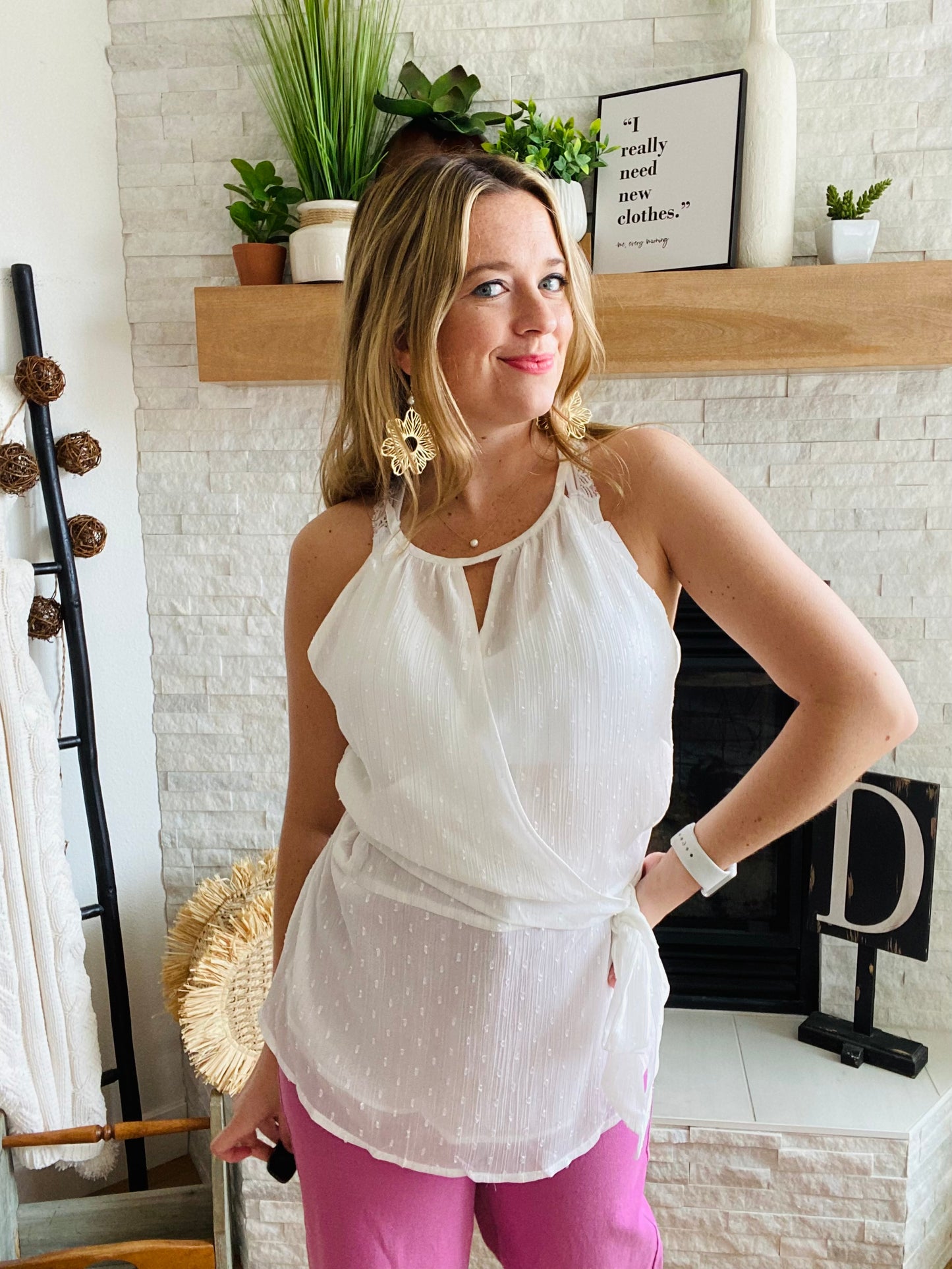 Look cute and feel comfy in this lightweight and flattering wrap tank top! The classic swiss dot pattern is a timeless and elegant touch, while the keyhole neckline and wrap waist provide just the right amount of shape. Perfect for warm days that scream for a tank top style. Enjoy!