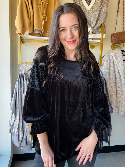 Umgee
Elevate your style with this playful black velvet burnout top, featuring a stunning animal velvet pattern and delicate ladder trim detail. Its soft texture and unique design add a fun twist to any outfit, perfect for those who love mixing comfort with a hint of wild flair.