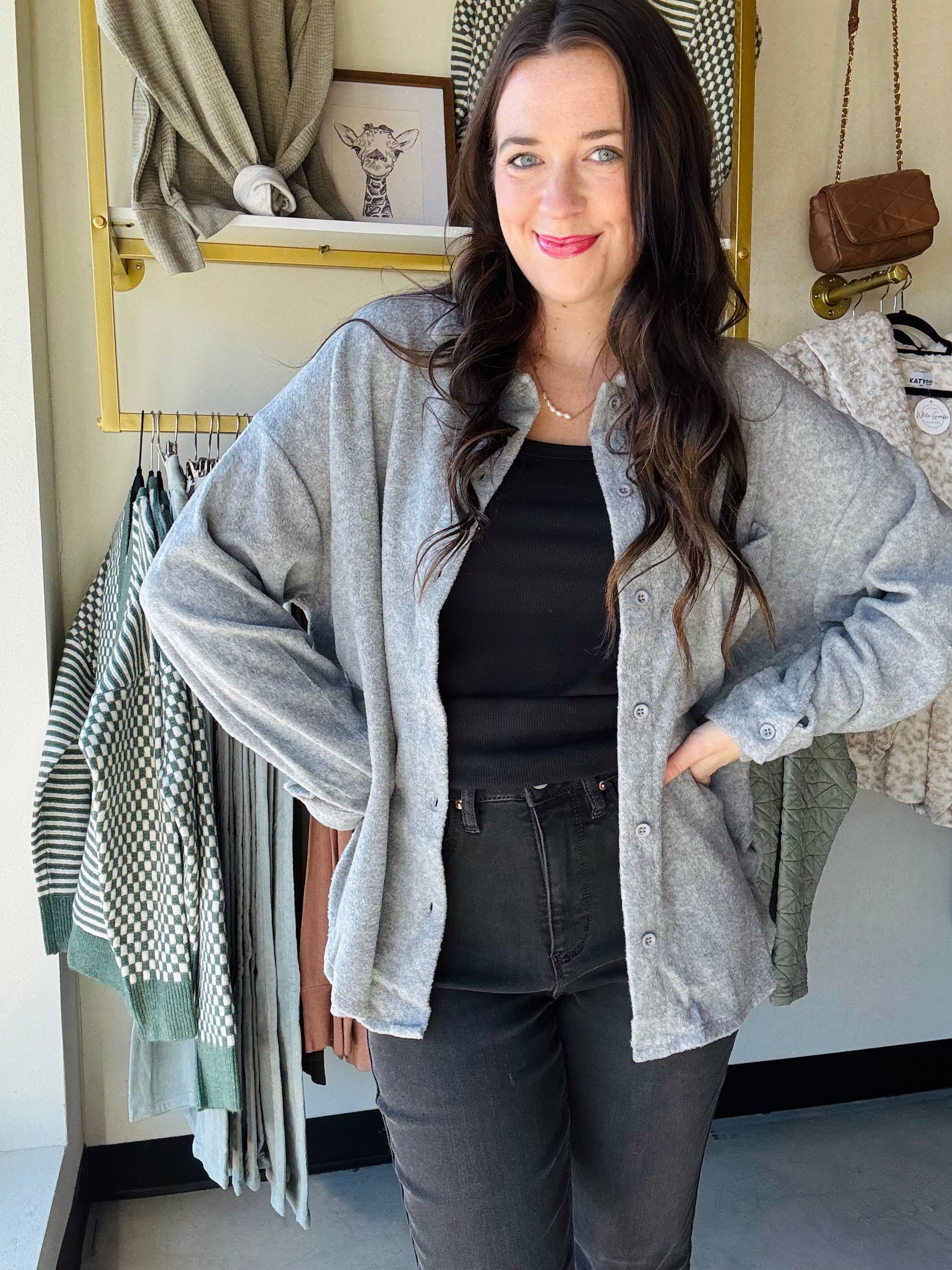 Crafted from a breathable, lightweight fabric, this top features a classic collar that frames the neckline beautifully, and button-down detailing for a polished look. Its soft, tailored fit flatters any silhouette, while long sleeves add a touch of warmth for cooler days.