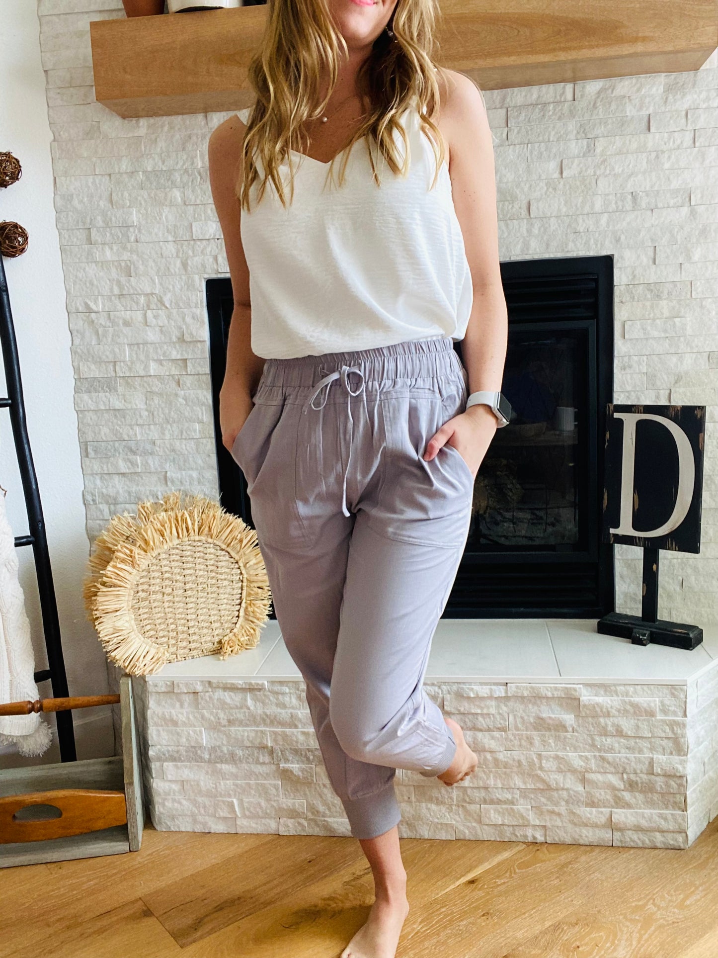 Our Grey Casual Vibes Joggers have a stylish, tapered cut that features pockets, allowing you to easily access your essentials. Whether you want to dress them up or down, they'll be perfect for both casual and business settings. Pair them with sandals and a blazer for a smart, put-together look.