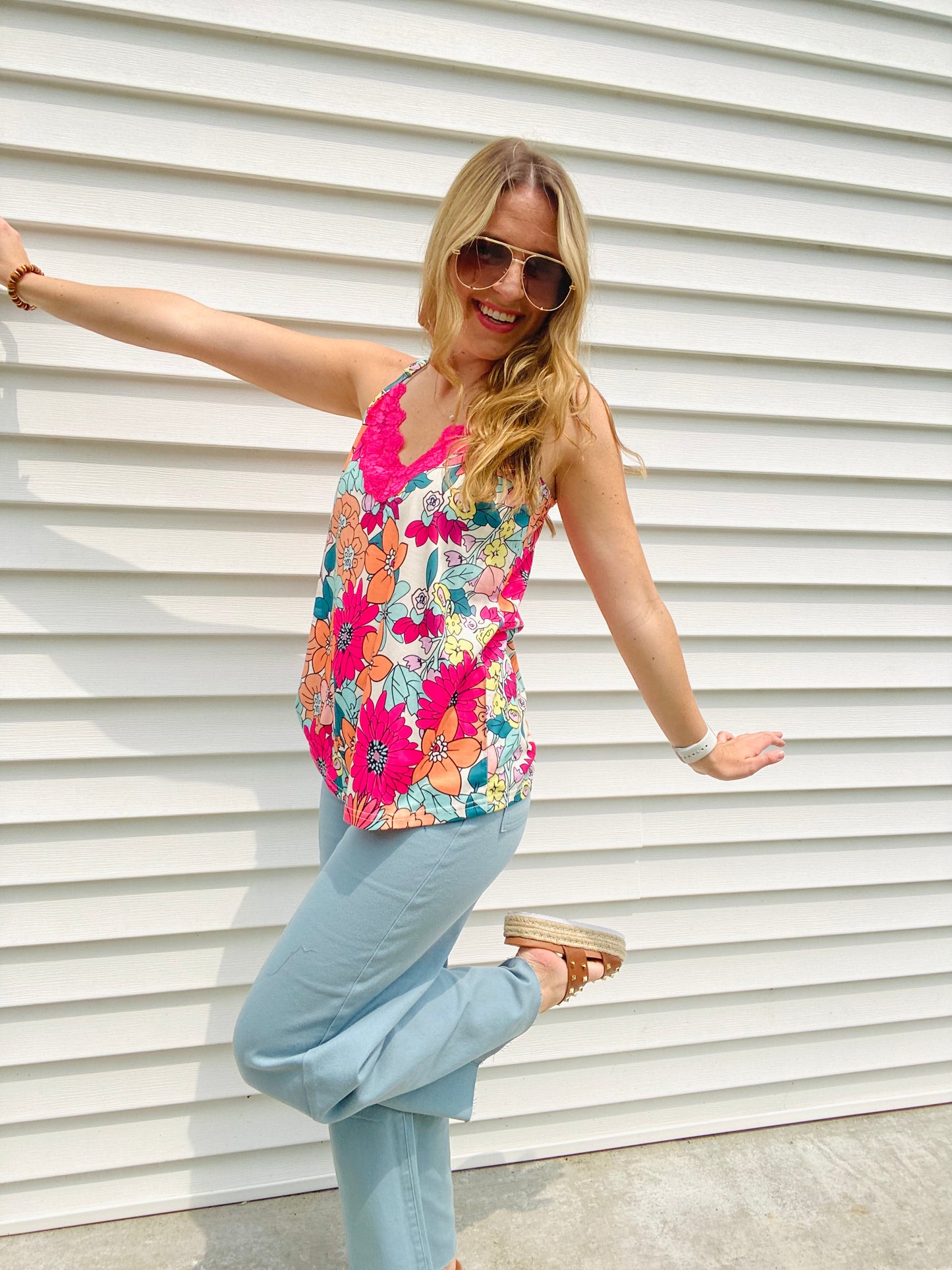 Look summer-ready in this light and flowy Vibrant Floral Lace Accent Tank. With its slightly oversized fit and beautiful hot pink lace detail and floral design, this tank is perfect for any warm-weather occasion. Enjoy the style and comfort of this timeless piece.